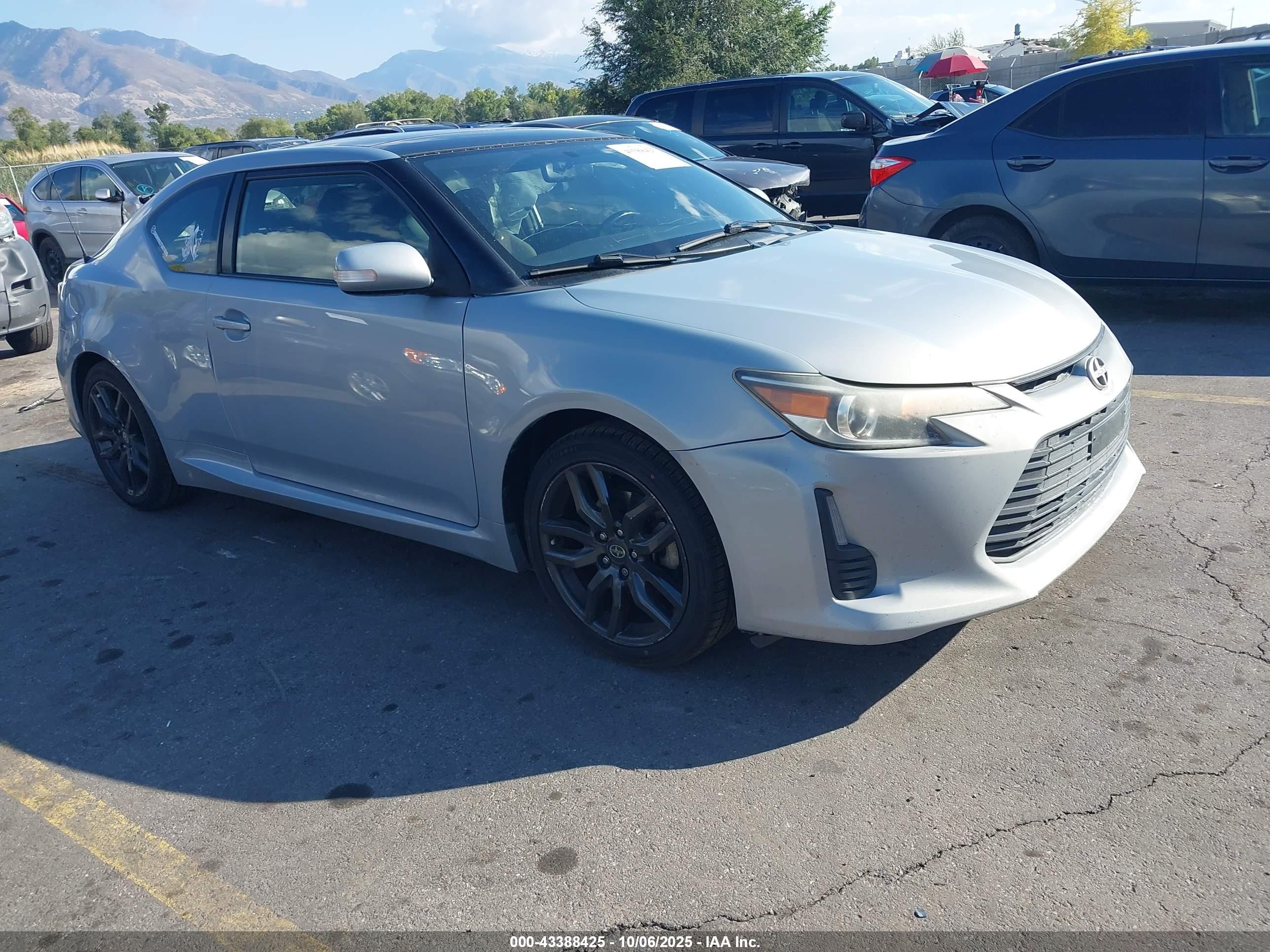 2014 Scion tC VIN JTKJF5C72E3069604 IAAI salvage auction — Side, Salvage (Utah), sold $1,625 on 2026-07-09 (photo 1)