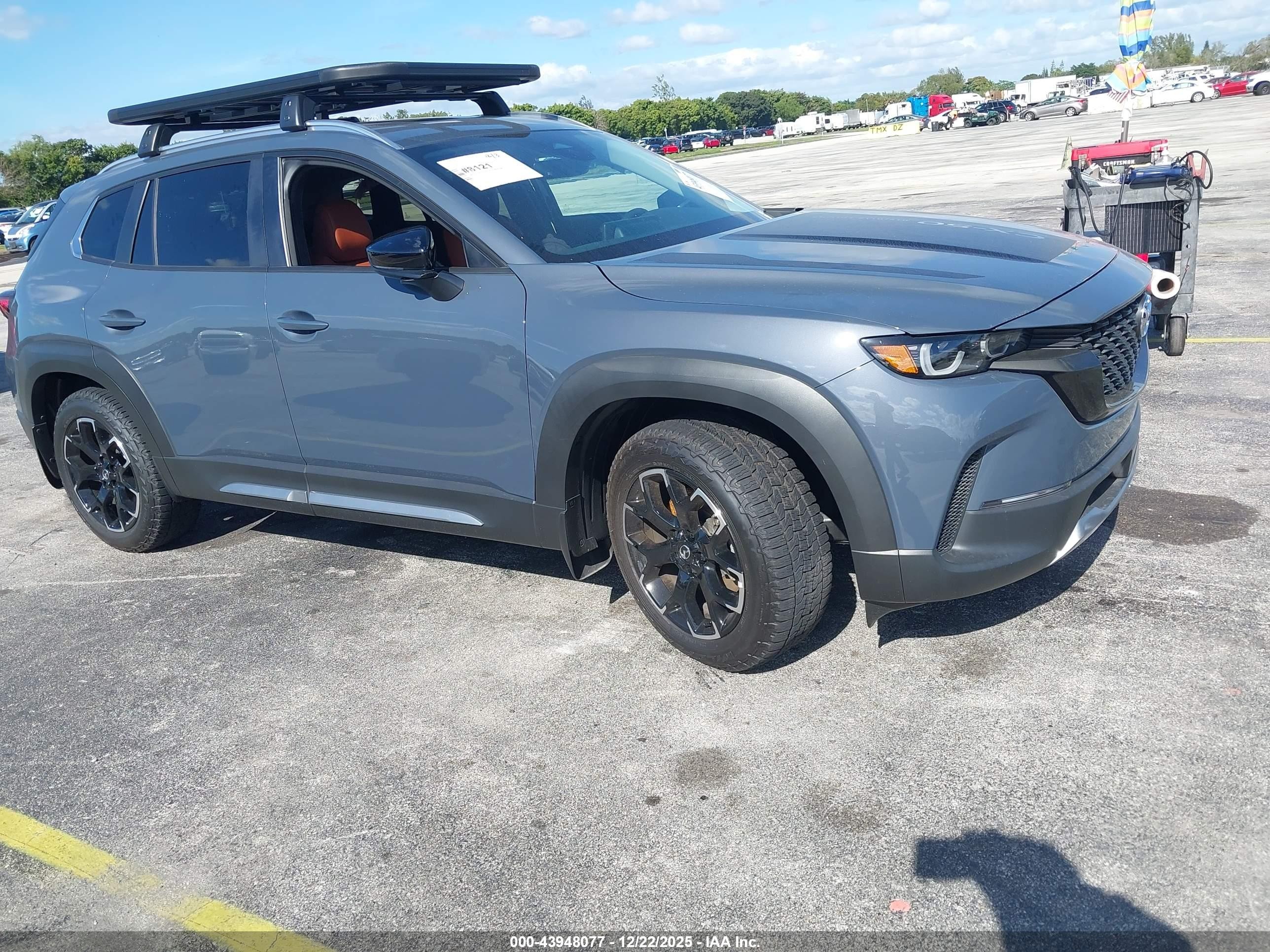 2025 Mazda CX-50 VIN 7MMVABXY9SN317209 IAAI salvage auction — Side, Rebuildable (Florida), sold $11,100 on 2026-07-10 (photo 1)