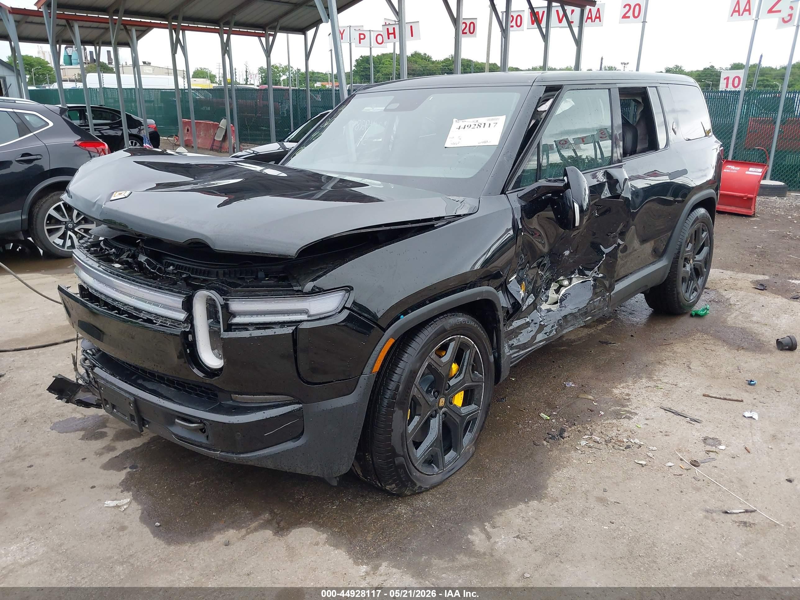2026 Rivian R1S VIN 7PDSGBBP9TN090825 IAAI salvage auction — Side, Salvage - Greater Than 75% (Maryland), sold $15,800 on 2026-09-17 (photo 2)