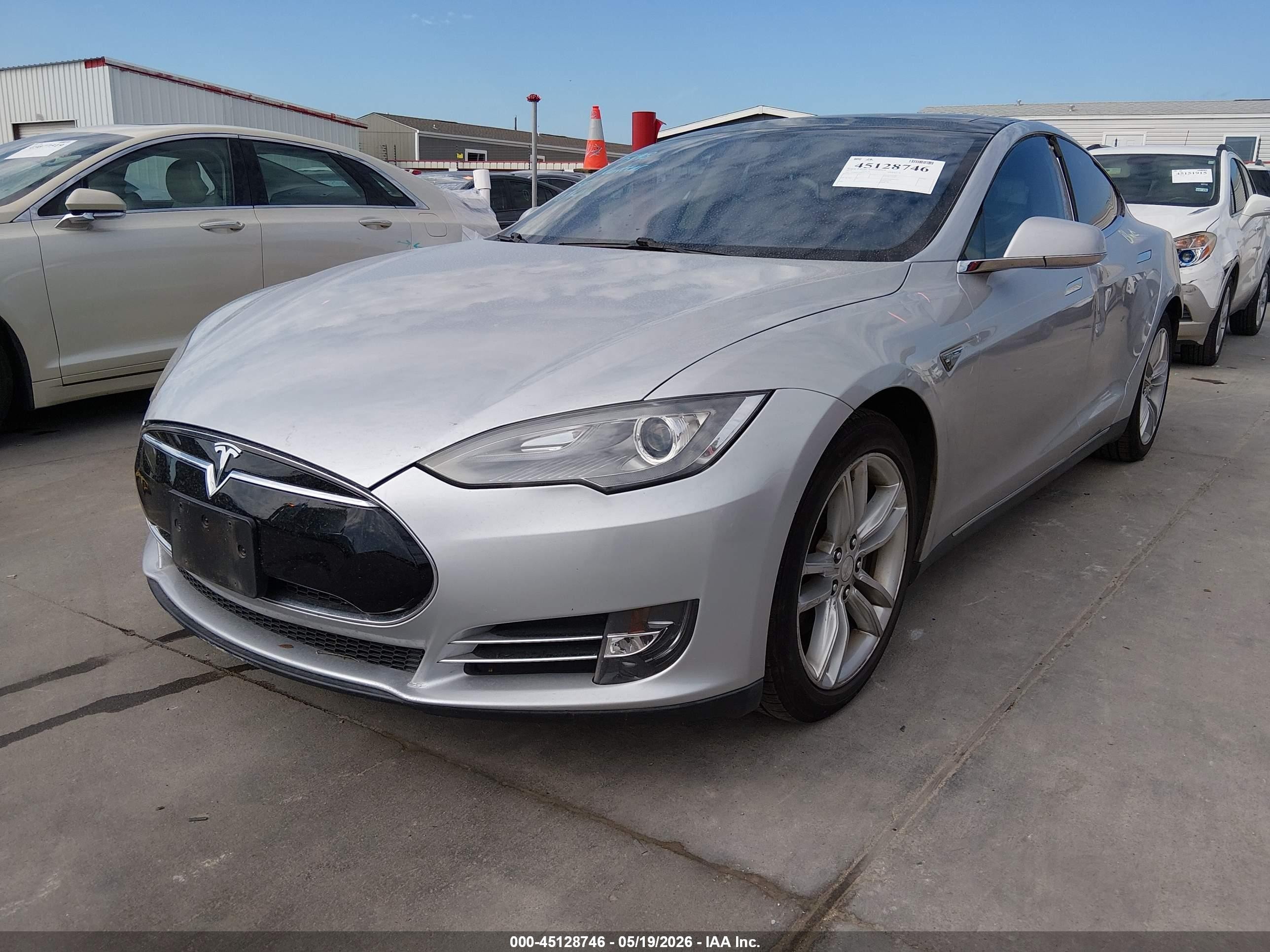 2013 Tesla Model S VIN 5YJSA1CN0DFP17217 IAAI salvage auction — Side, Original (Texas), sold $1,875 on 2026-06-30 (photo 2)