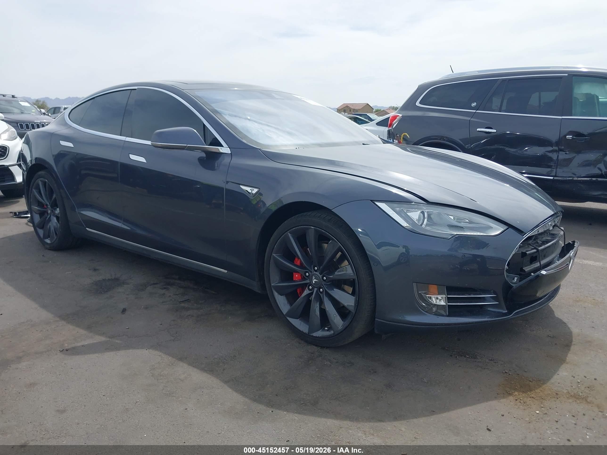 2016 Tesla Model S VIN 5YJSA1E44GF128518 — IAAI salvage auction photo
