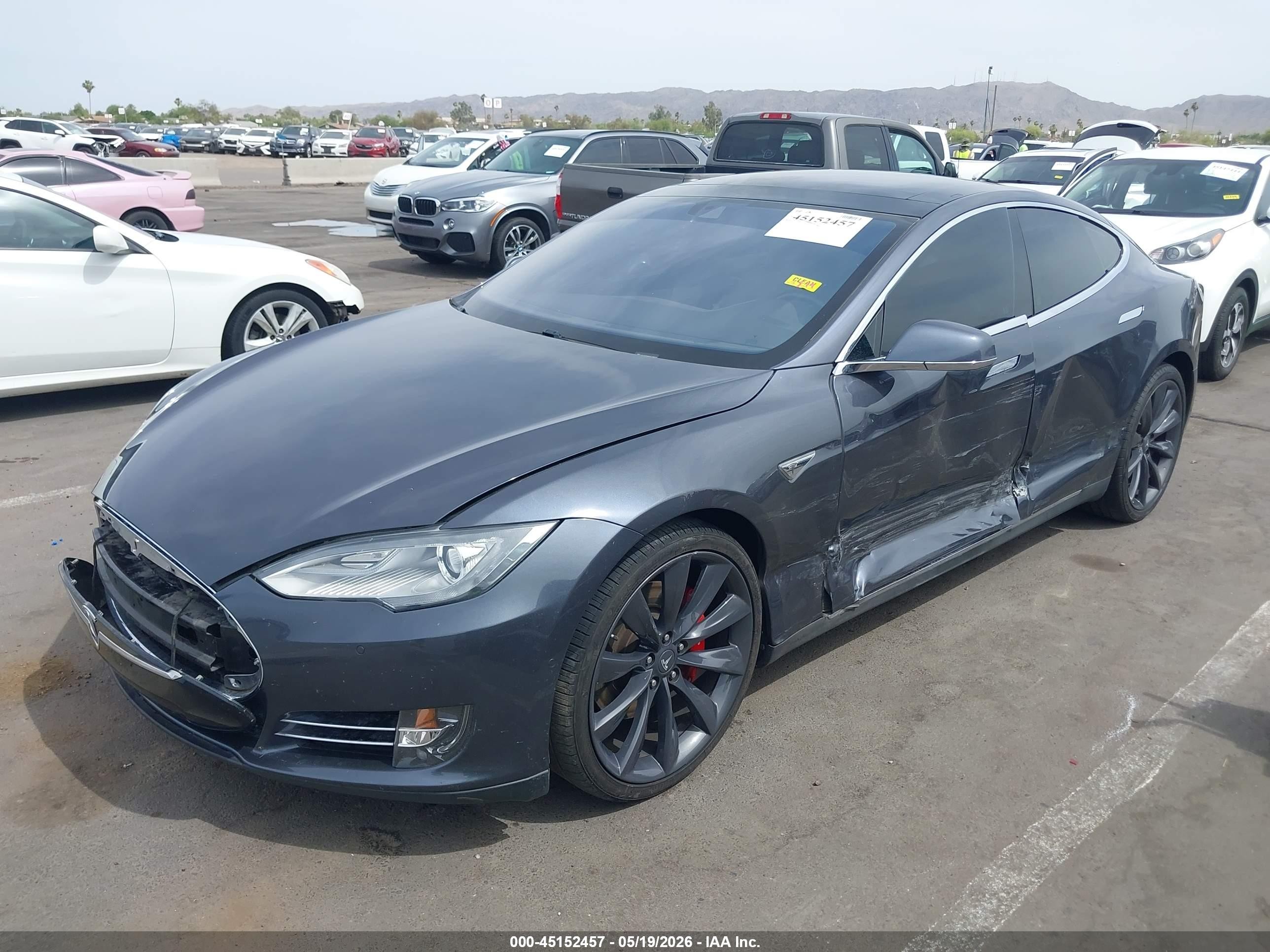 2016 Tesla Model S VIN 5YJSA1E44GF128518 IAAI salvage auction — Side, Salvage (Arizona), sold $3,350 on 2026-06-30 (photo 2)