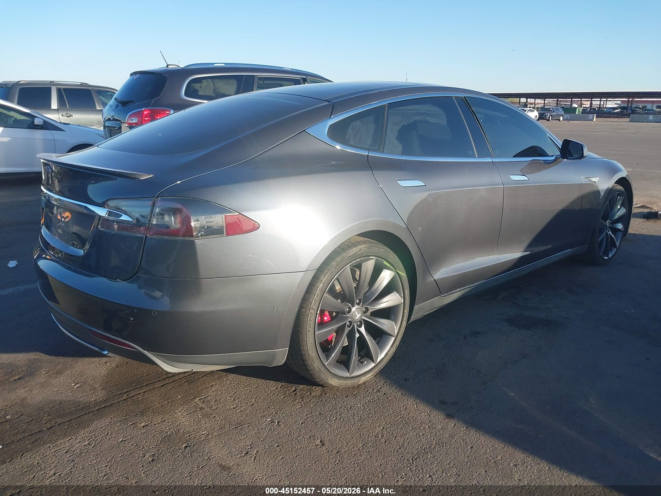 2016 Tesla Model S VIN 5YJSA1E44GF128518 IAAI salvage auction — Side, Salvage (Arizona), sold $3,350 on 2026-06-30 (photo 4)