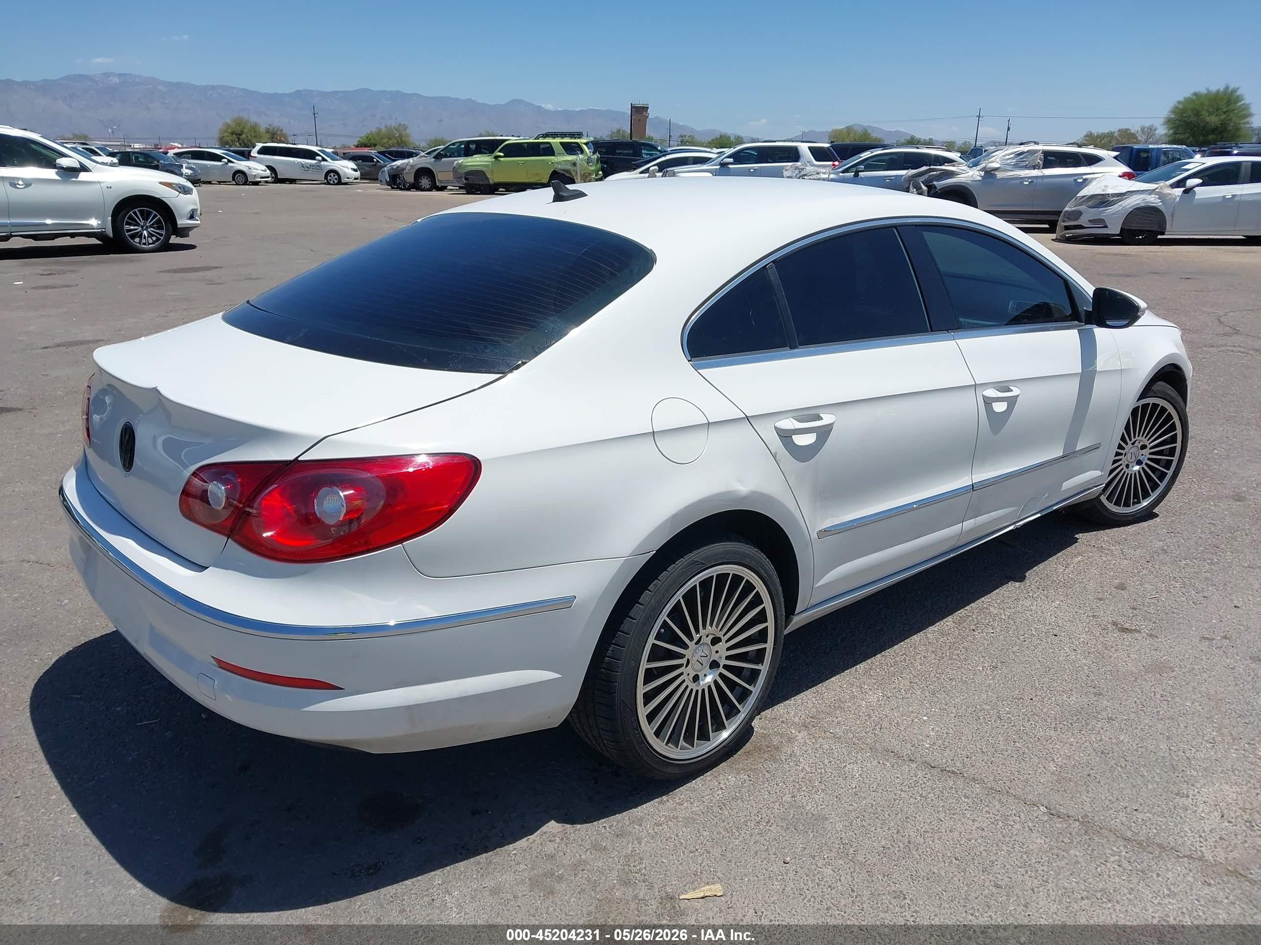 2012 Volkswagen CC VIN WVWMP7AN7CE536838 IAAI salvage auction — Side, Salvage (Arizona), sold $475 on 2026-07-09 (photo 4)