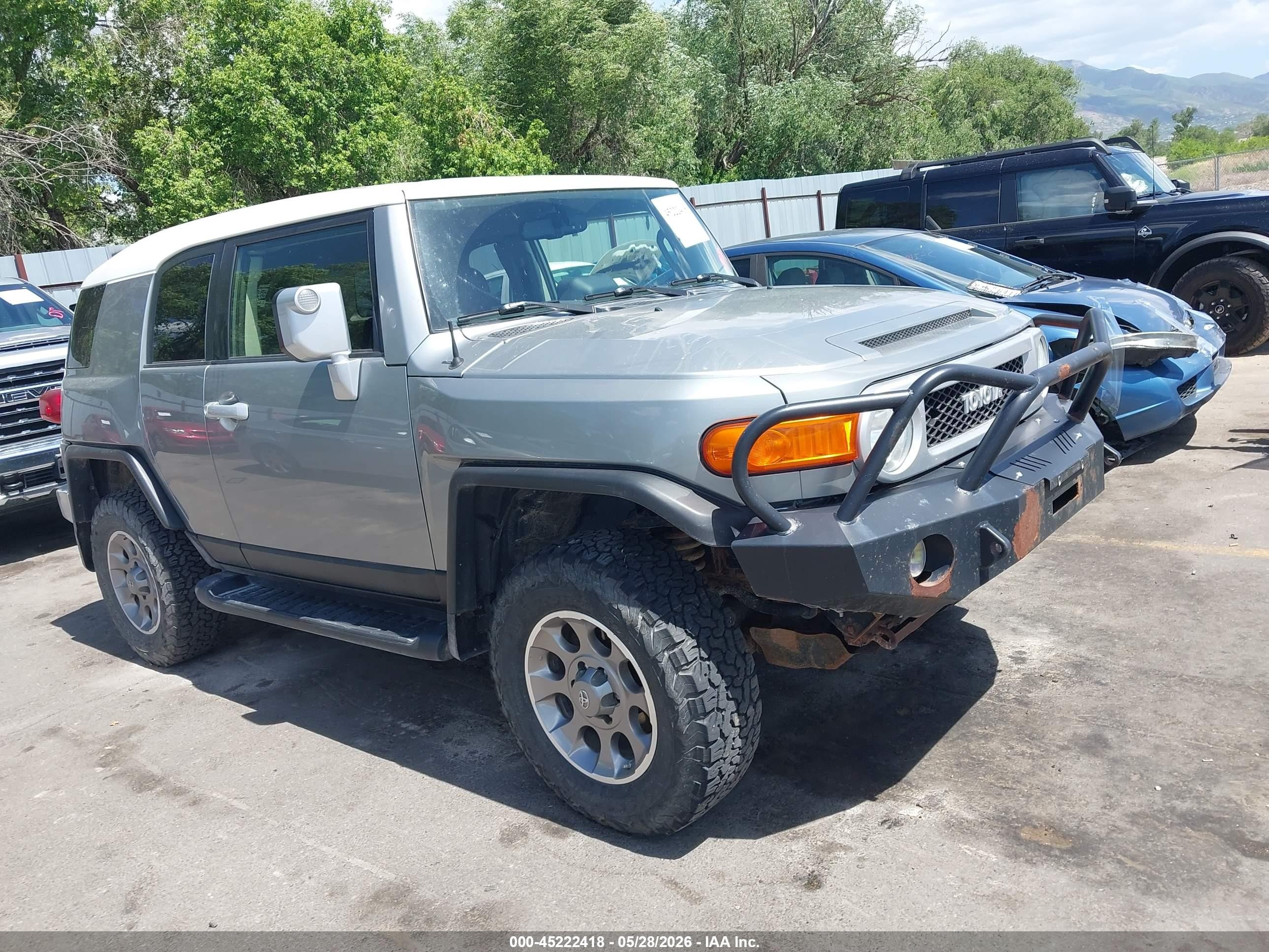 2012 Toyota FJ Cruiser VIN JTEBU4BF1CK138317 IAAI salvage auction — Side, Salvage (Utah), sold $4,500 on 2026-07-09 (photo 1)