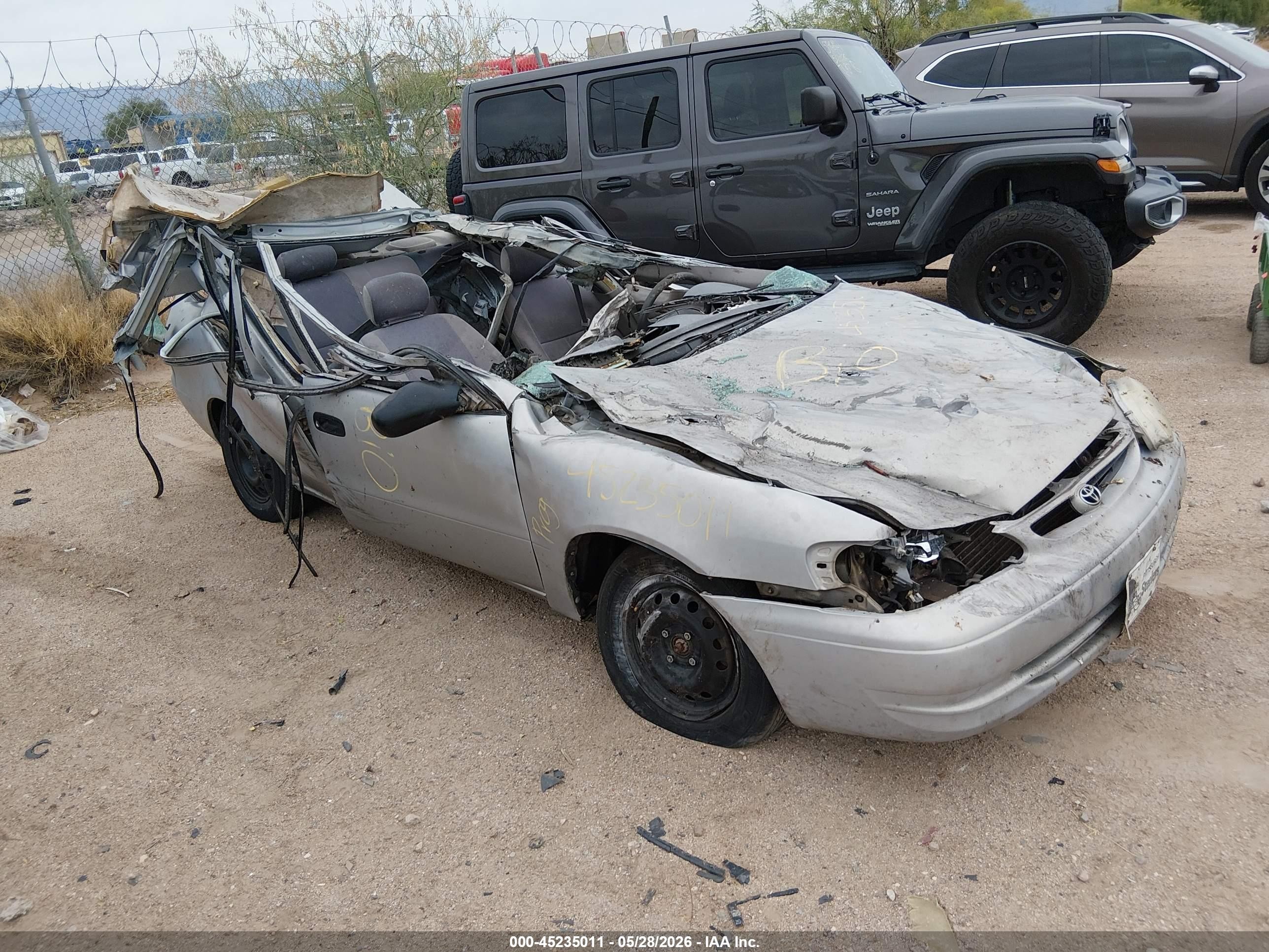 2000 Toyota Corolla VIN 1NXBR12E8YZ410848 IAAI salvage auction — All Over, Non-Repairable (Arizona), sold $75 on 2026-06-11 (photo 1)