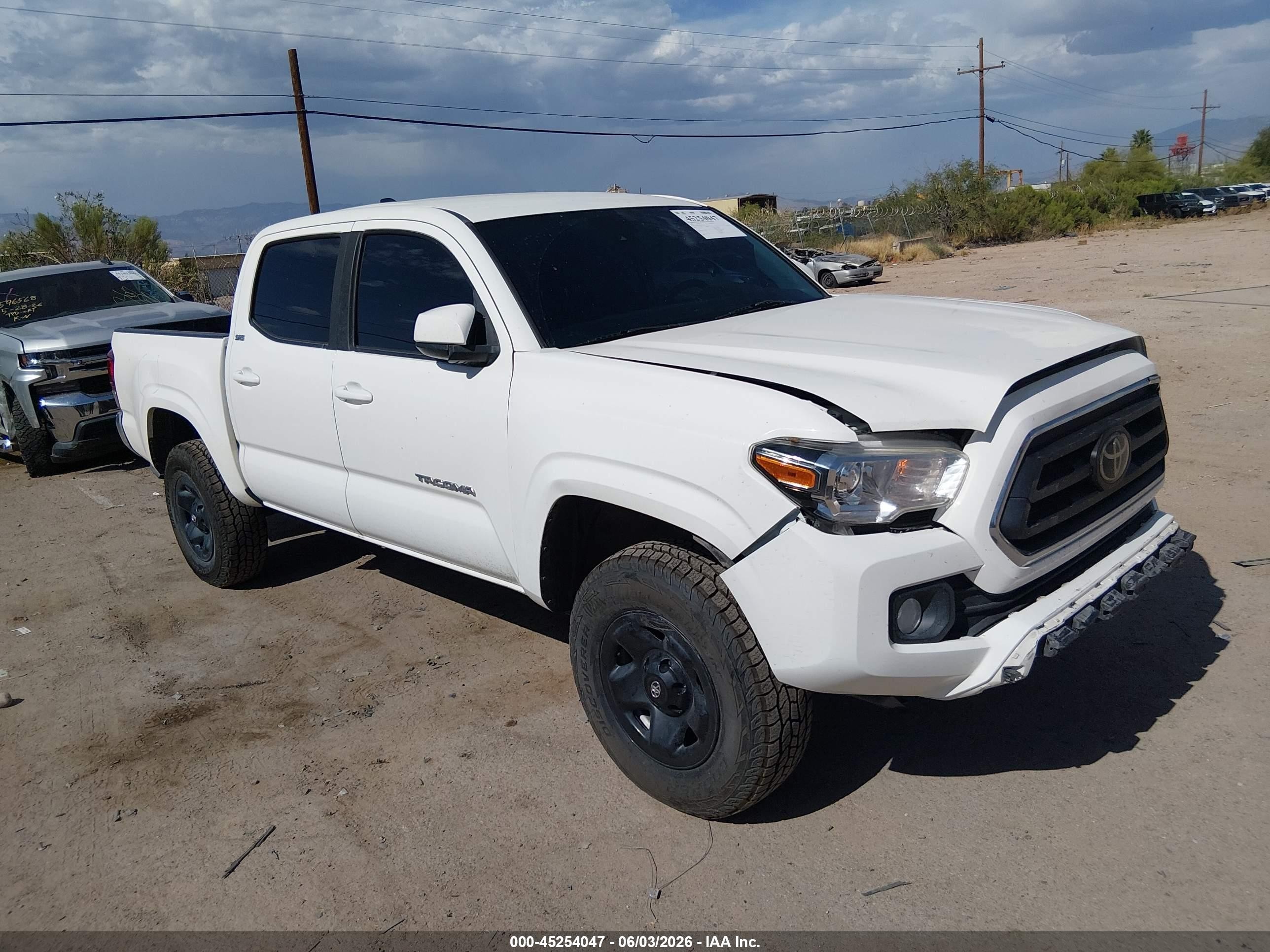 2021 Toyota Tacoma VIN 3TYAX5GN9MT023198 IAAI salvage auction — Front & Rear, Salvage (Arizona), sold $10,000 on 2026-07-09 (photo 1)