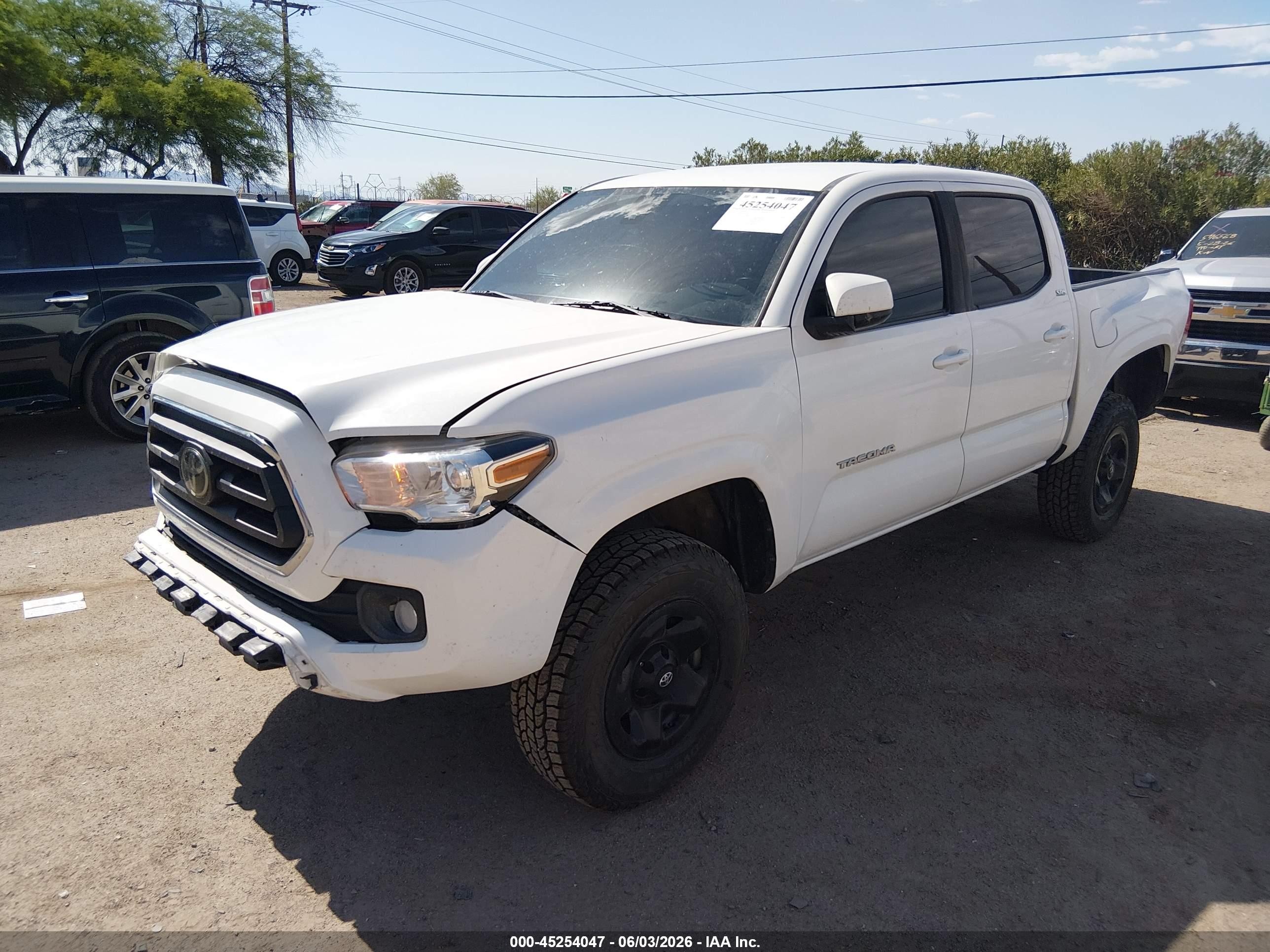 2021 Toyota Tacoma VIN 3TYAX5GN9MT023198 IAAI salvage auction — Front & Rear, Salvage (Arizona), sold $10,000 on 2026-07-09 (photo 2)