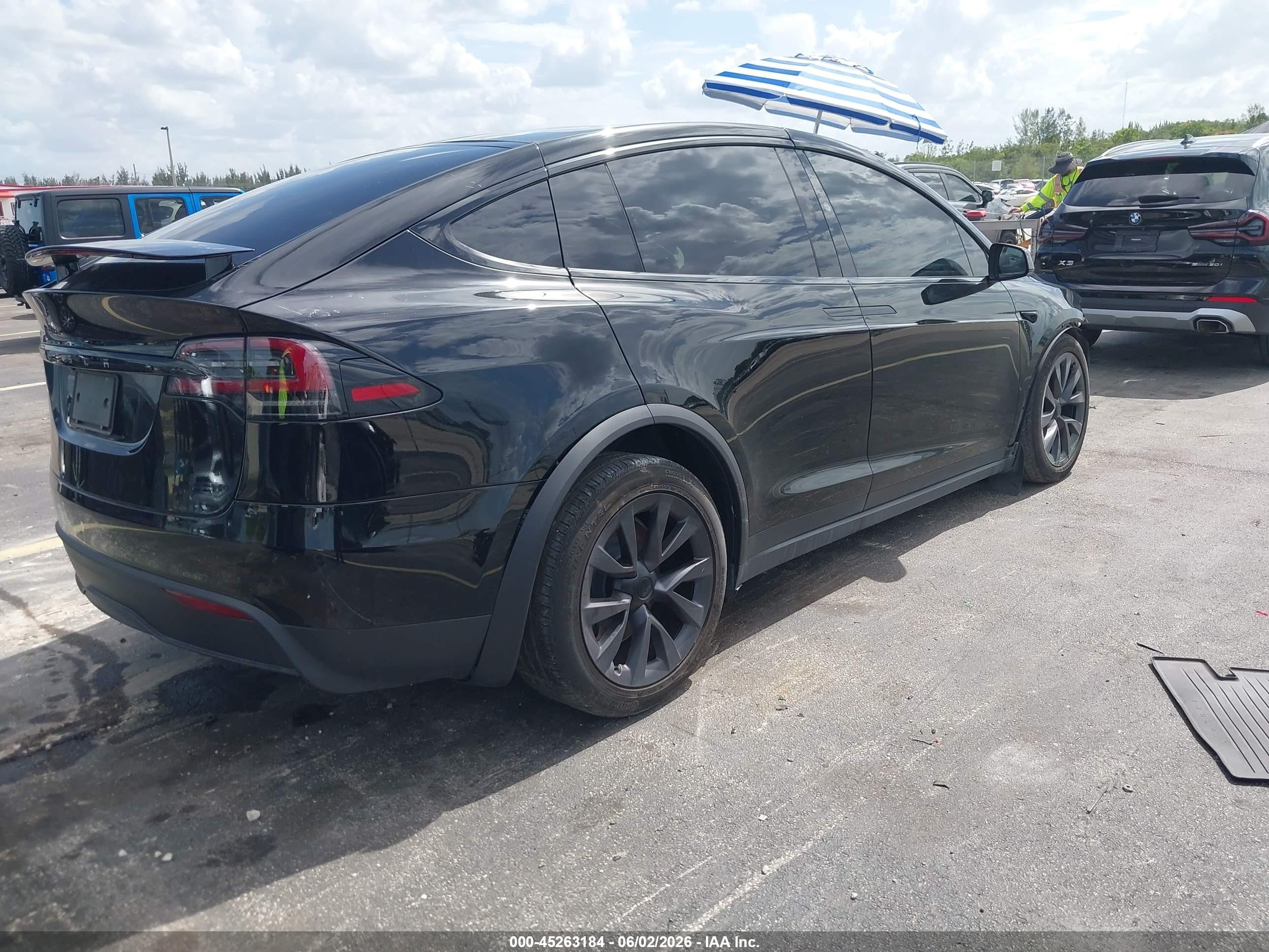 2024 Tesla Model x VIN 7SAXCDE56RF460007 IAAI salvage auction — Unknown, Rebuildable (Florida), sold $19,000 on 2026-08-13 (photo 4)