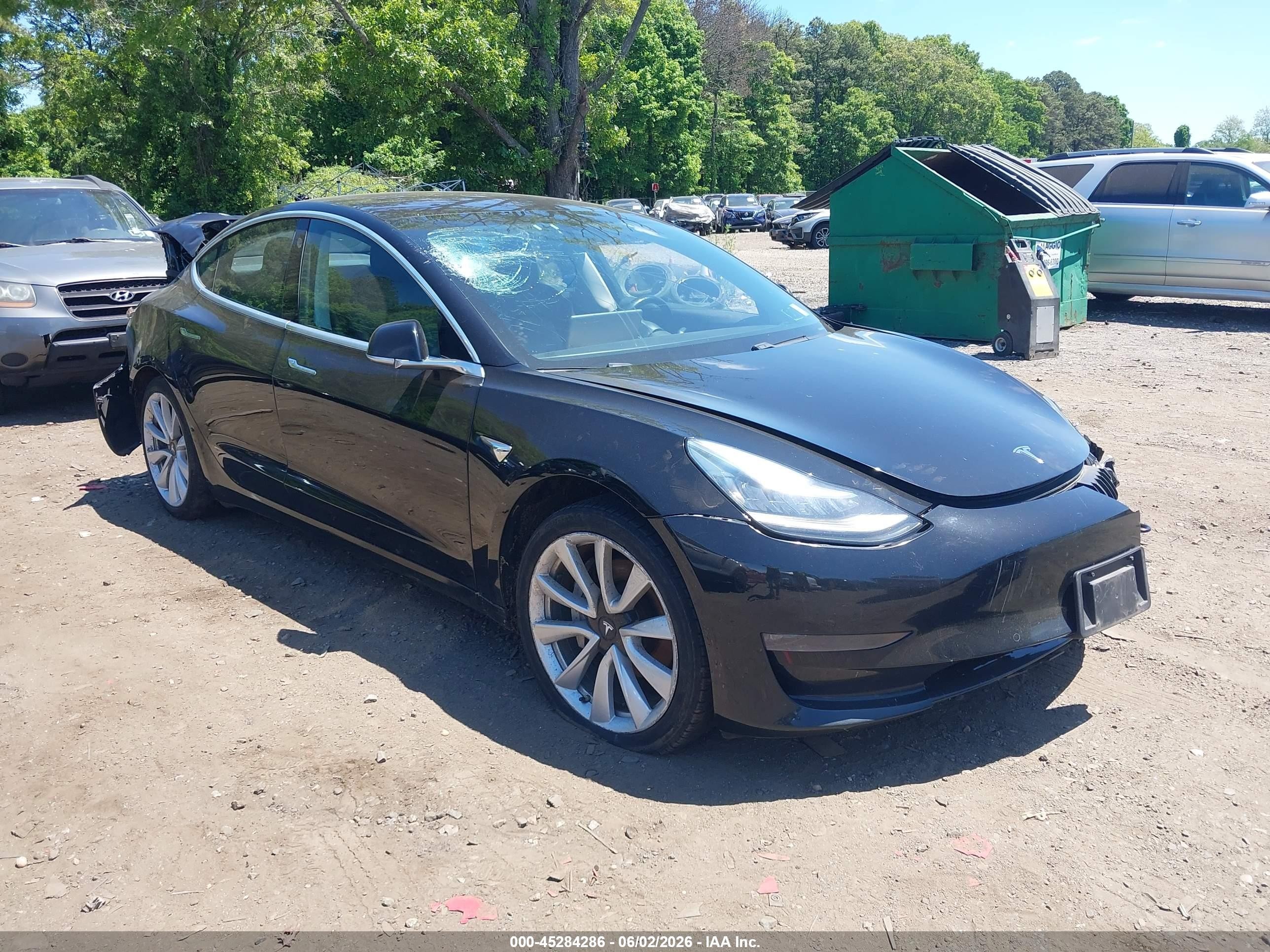 2018 Tesla Model 3 VIN 5YJ3E1EA5JF049736 IAAI salvage auction — Normal Wear, Clear (New York), sold $1,600 on 2026-06-30 (photo 1)