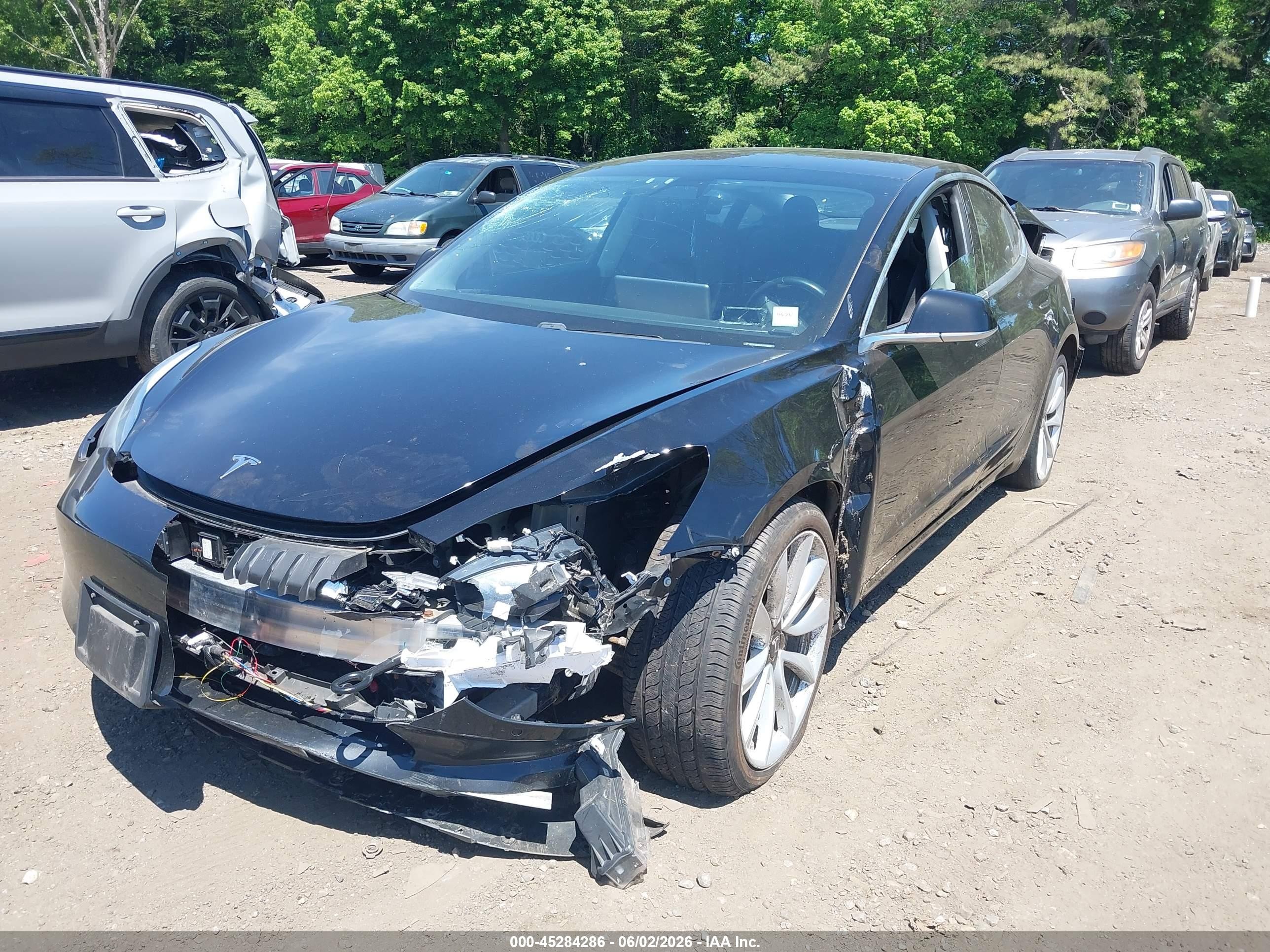 2018 Tesla Model 3 VIN 5YJ3E1EA5JF049736 IAAI salvage auction — Normal Wear, Clear (New York), sold $1,600 on 2026-06-30 (photo 2)