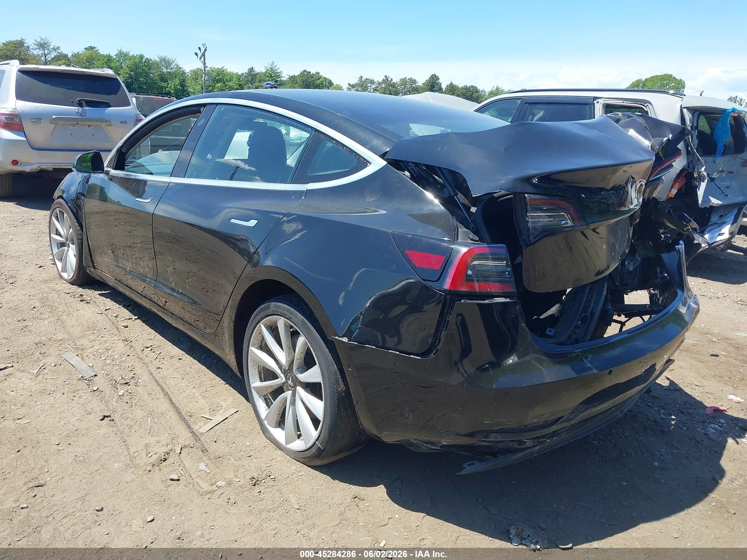 2018 Tesla Model 3 VIN 5YJ3E1EA5JF049736 IAAI salvage auction — Normal Wear, Clear (New York), sold $1,600 on 2026-06-30 (photo 3)