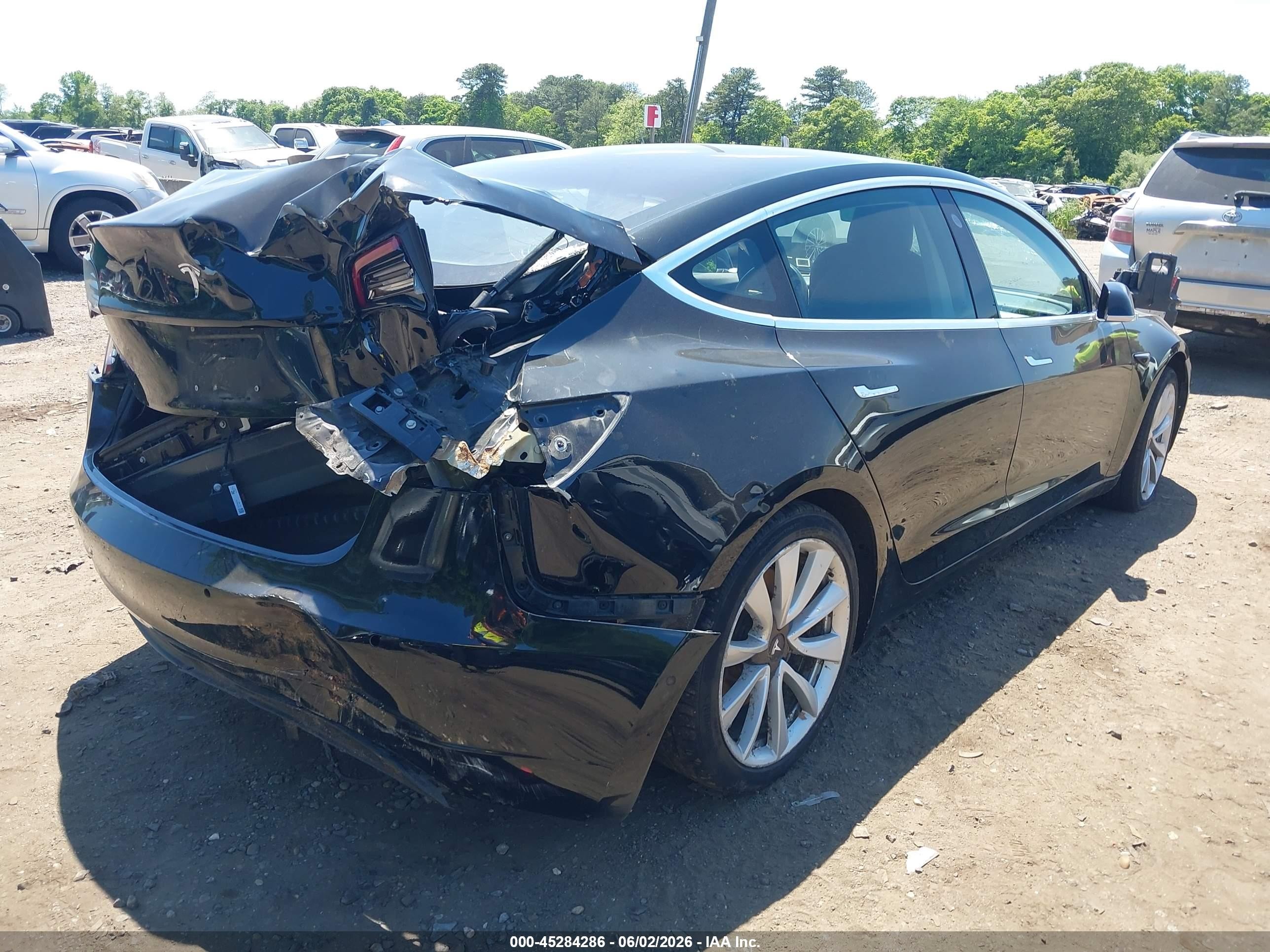 2018 Tesla Model 3 VIN 5YJ3E1EA5JF049736 IAAI salvage auction — Normal Wear, Clear (New York), sold $1,600 on 2026-06-30 (photo 4)