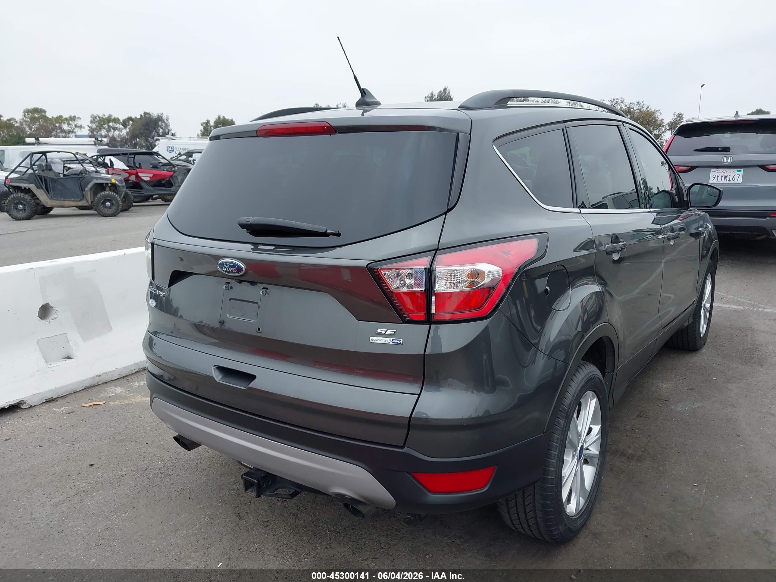 2018 Ford Escape VIN 1FMCU9GD8JUB61099 IAAI salvage auction — Normal Wear, Clear-Dealer Only (Arizona), sold $2,050 on 2026-07-09 (photo 4)