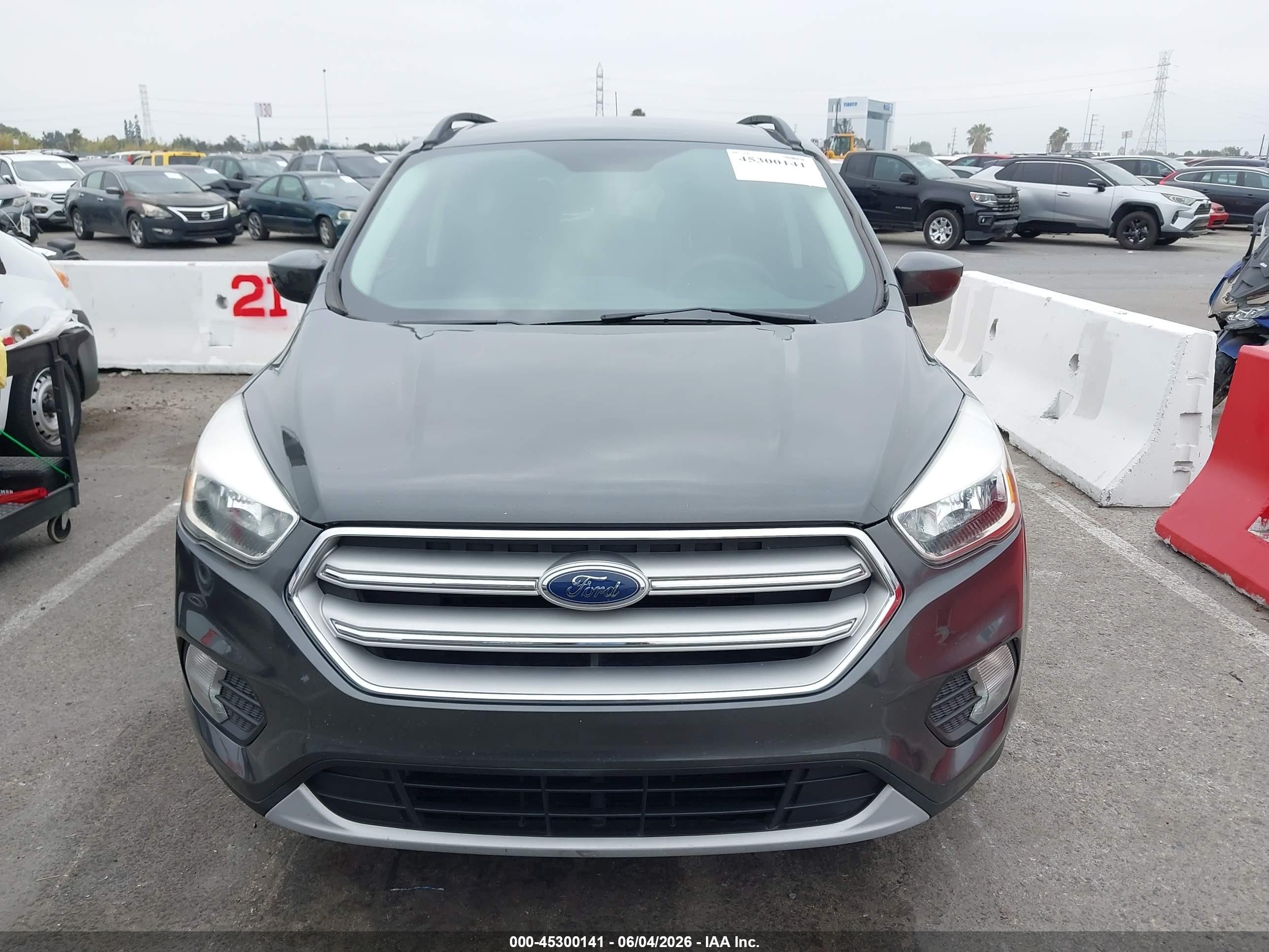 2018 Ford Escape VIN 1FMCU9GD8JUB61099 IAAI salvage auction — Normal Wear, Clear-Dealer Only (Arizona), sold $2,050 on 2026-07-09 (photo 6)