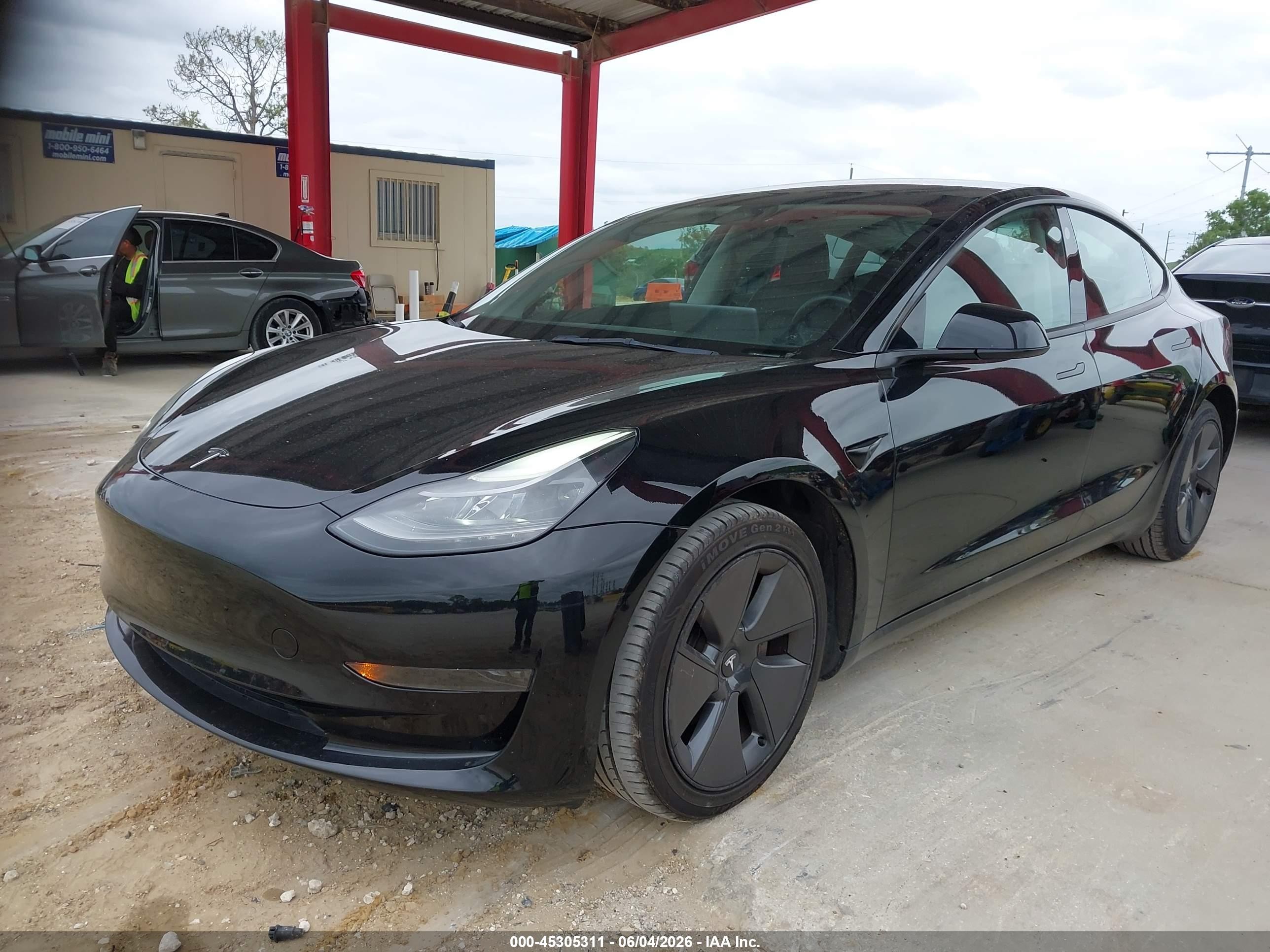 2023 Tesla Model 3 VIN 5YJ3E1EA6PF433985 IAAI salvage auction — Electrical, Certificate Of Title (Montana), sold $11,250 on 2026-06-30 (photo 2)