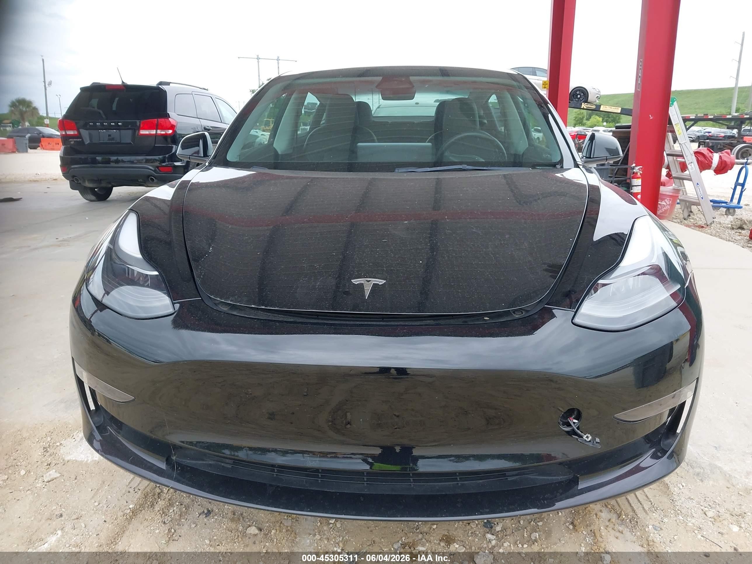 2023 Tesla Model 3 VIN 5YJ3E1EA6PF433985 IAAI salvage auction — Electrical, Certificate Of Title (Montana), sold $11,250 on 2026-06-30 (photo 6)