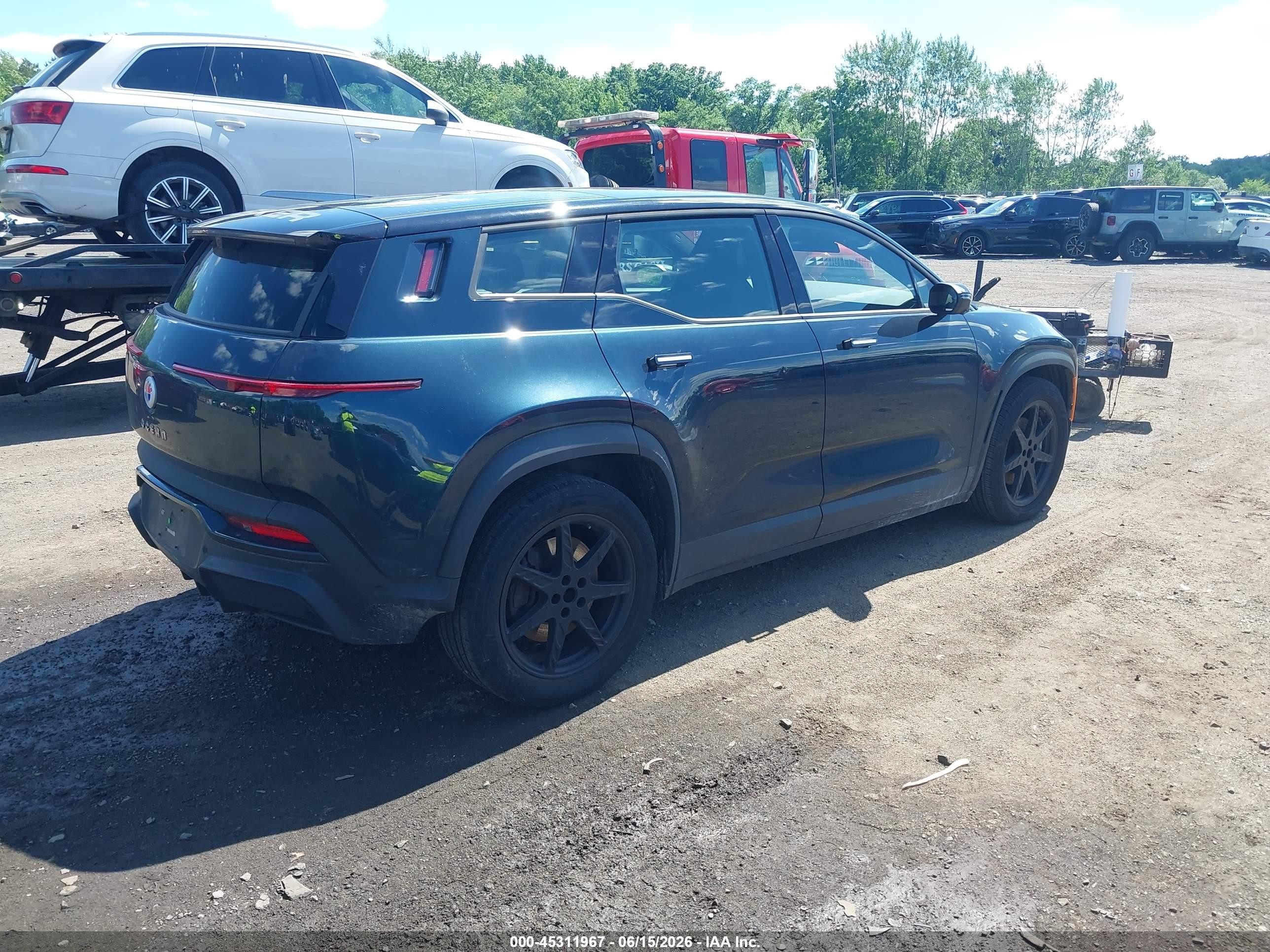 2023 Fisker Inc. Ocean VIN VCF1EBU24PG008066 IAAI salvage auction — Side, Salvage (Idaho), sold $7,450 on 2026-08-19 (photo 4)