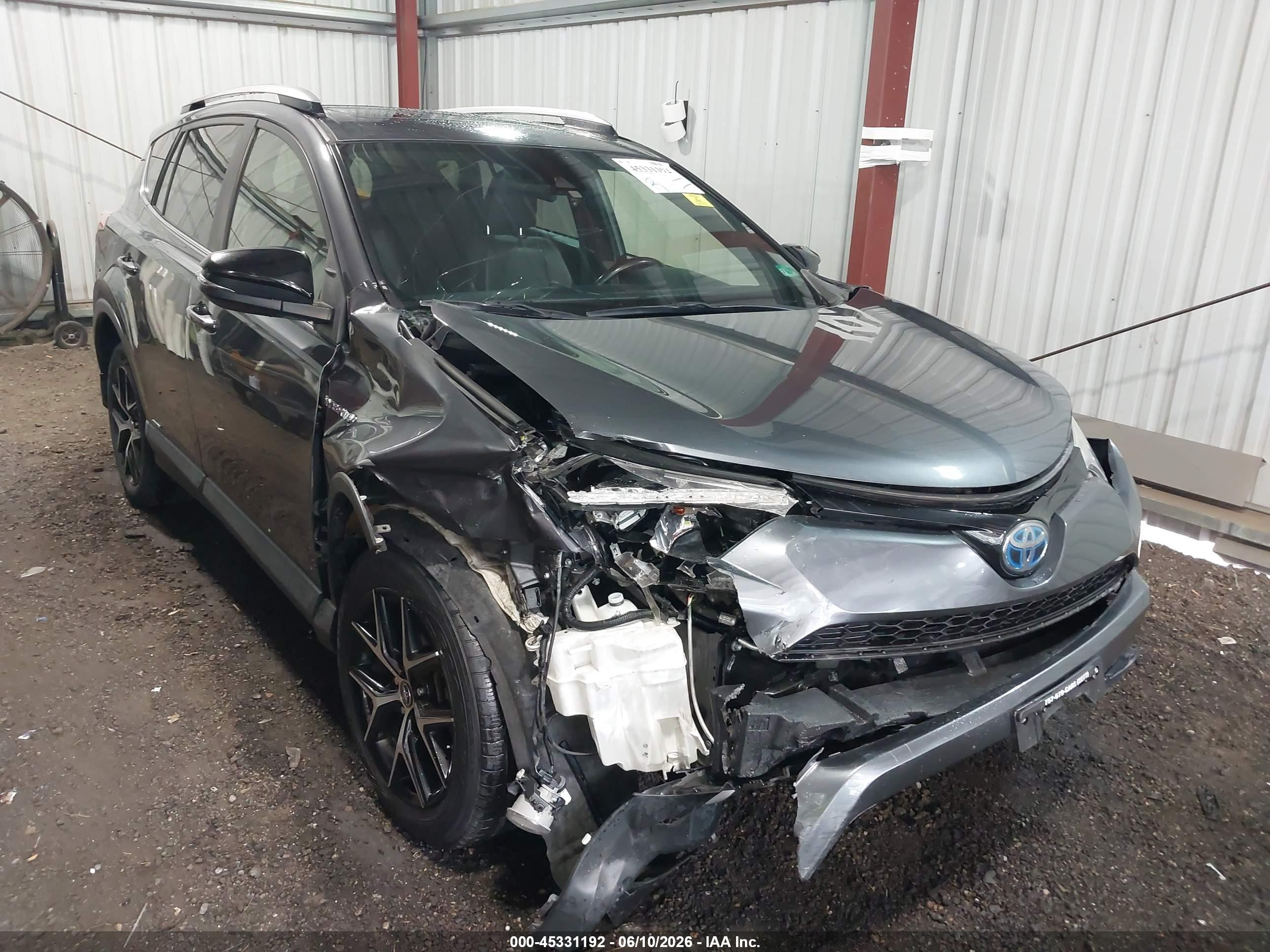 2018 Toyota RAV4 Hybrid VIN JTMJJREV4JD246070 — IAAI salvage auction photo
