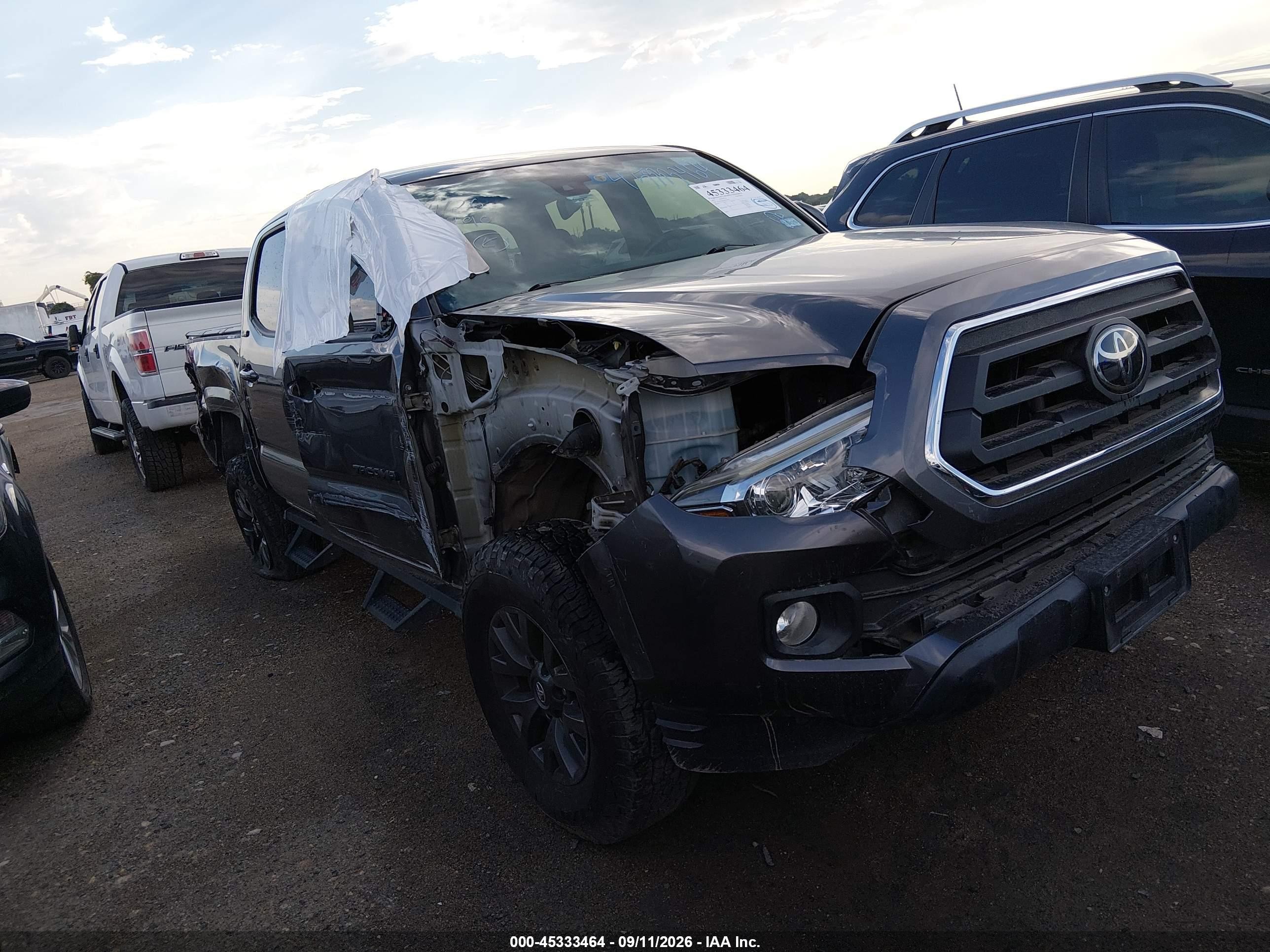 2021 Toyota Tacoma VIN 5TFAZ5CNXMX100439 — IAAI salvage auction photo