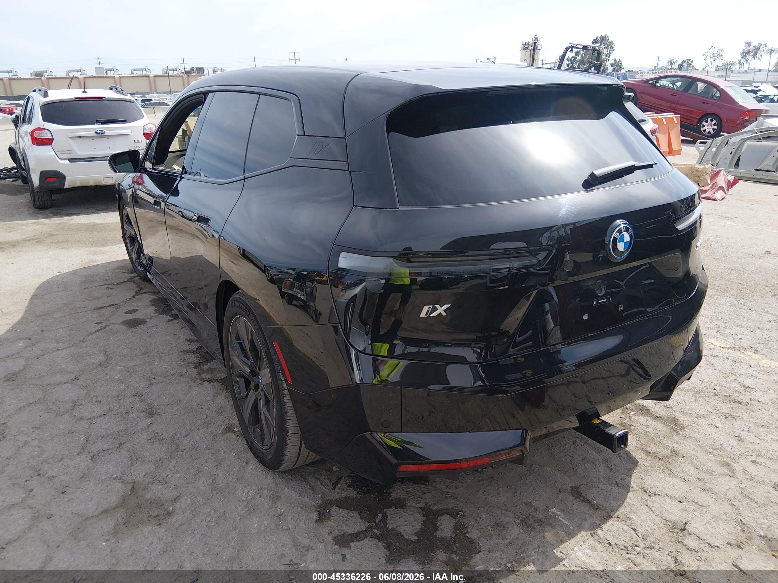 2024 BMW Ix VIN WB523CF06RCR48869 IAAI salvage auction — Side, Salvage (California), sold $32,500 on 2026-08-11 (photo 3)