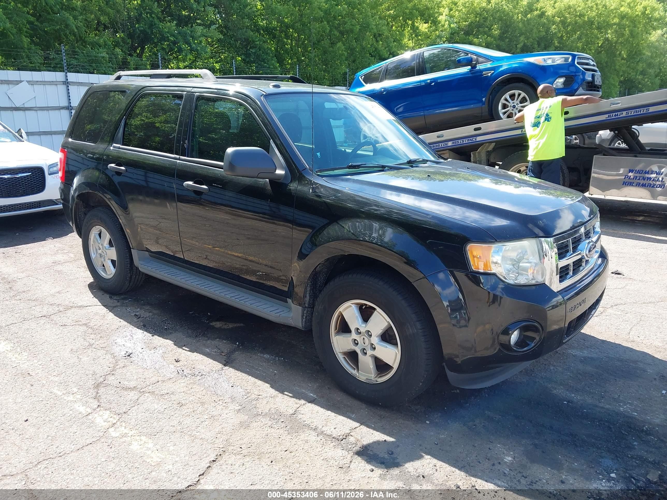2010 Ford Escape VIN 1FMCU0DG7AKA87048 IAAI salvage auction — Normal Wear, Clear (Michigan), sold $400 on 2026-07-12 (photo 1)