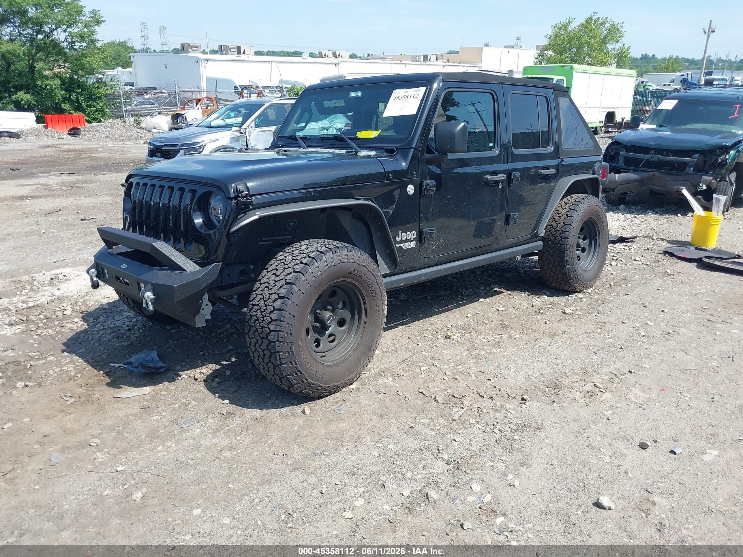 2019 Jeep Wrangler Unlimited VIN 1C4HJXDG5KW648451 IAAI salvage auction — Side, Salvage (Pennsylvania), sold $6,600 on 2026-07-12 (photo 2)