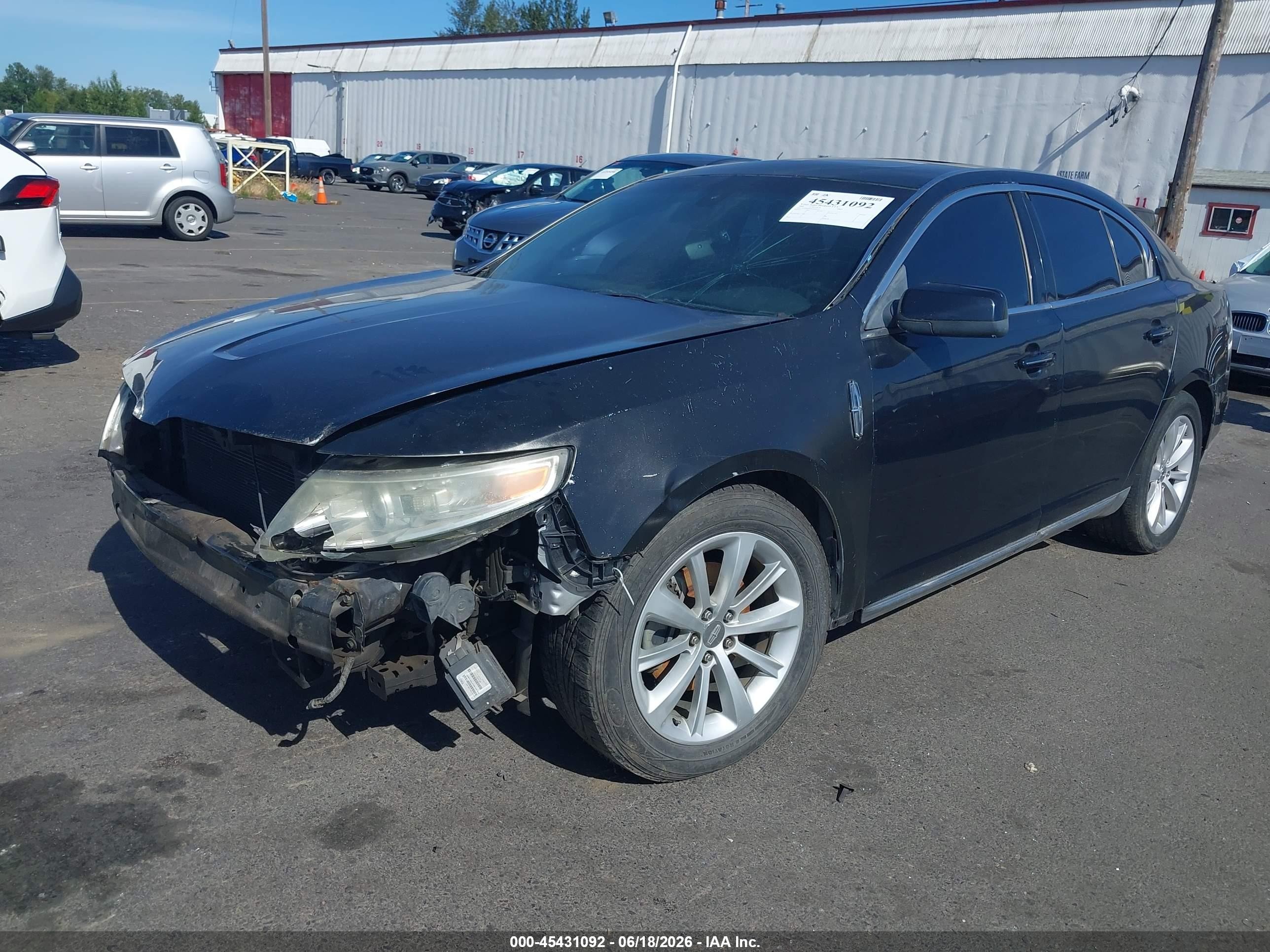 2009 Lincoln MKS VIN 1LNHM94RX9G608922 IAAI salvage auction — Front & Rear, Salvage (Oregon), sold $325 on 2026-07-09 (photo 2)