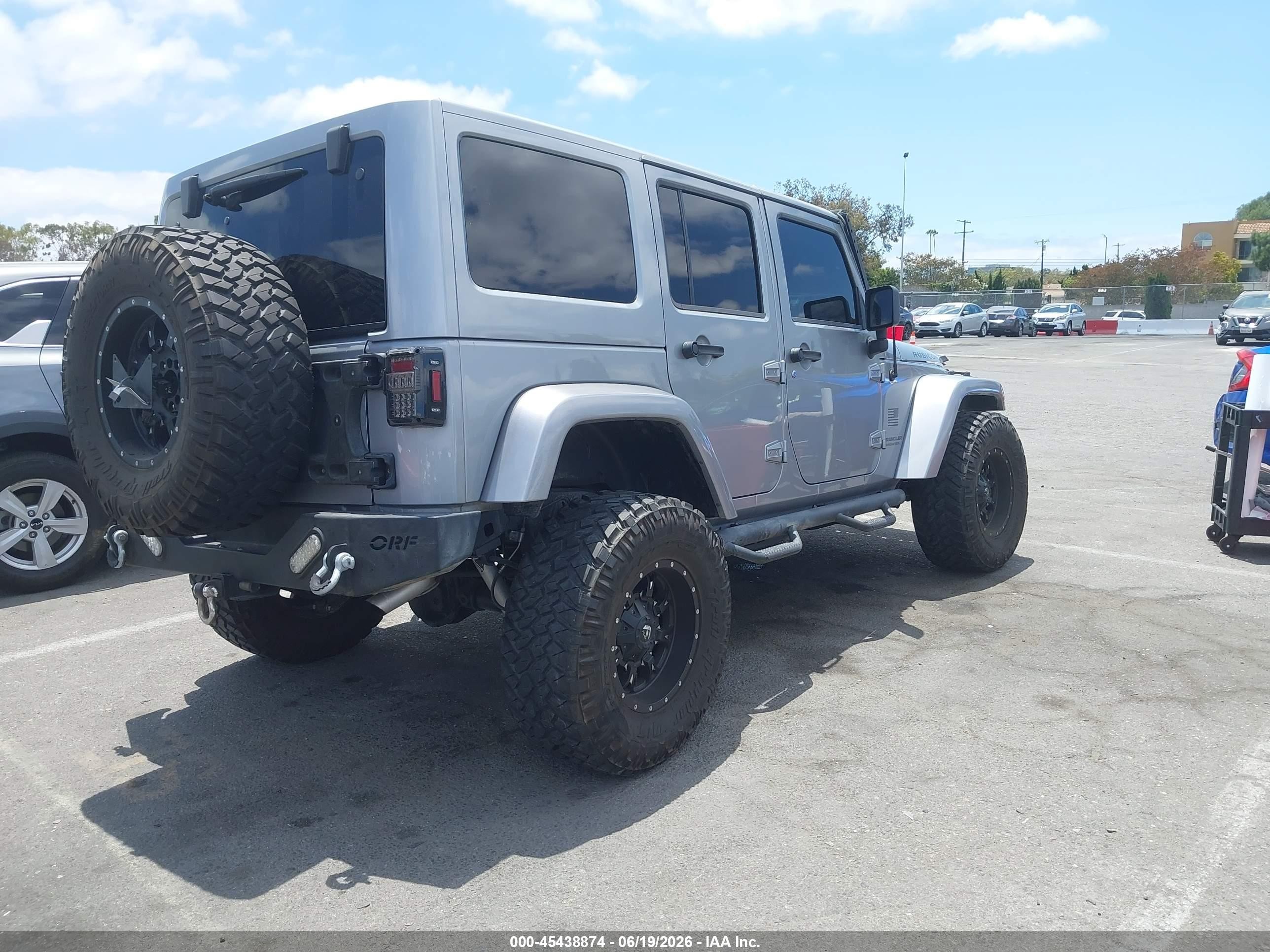 2014 Jeep Wrangler Unlimited VIN 1C4BJWFG5EL120203 IAAI salvage auction — Unknown, Salvage (California), sold $8,000 on 2026-07-09 (photo 4)
