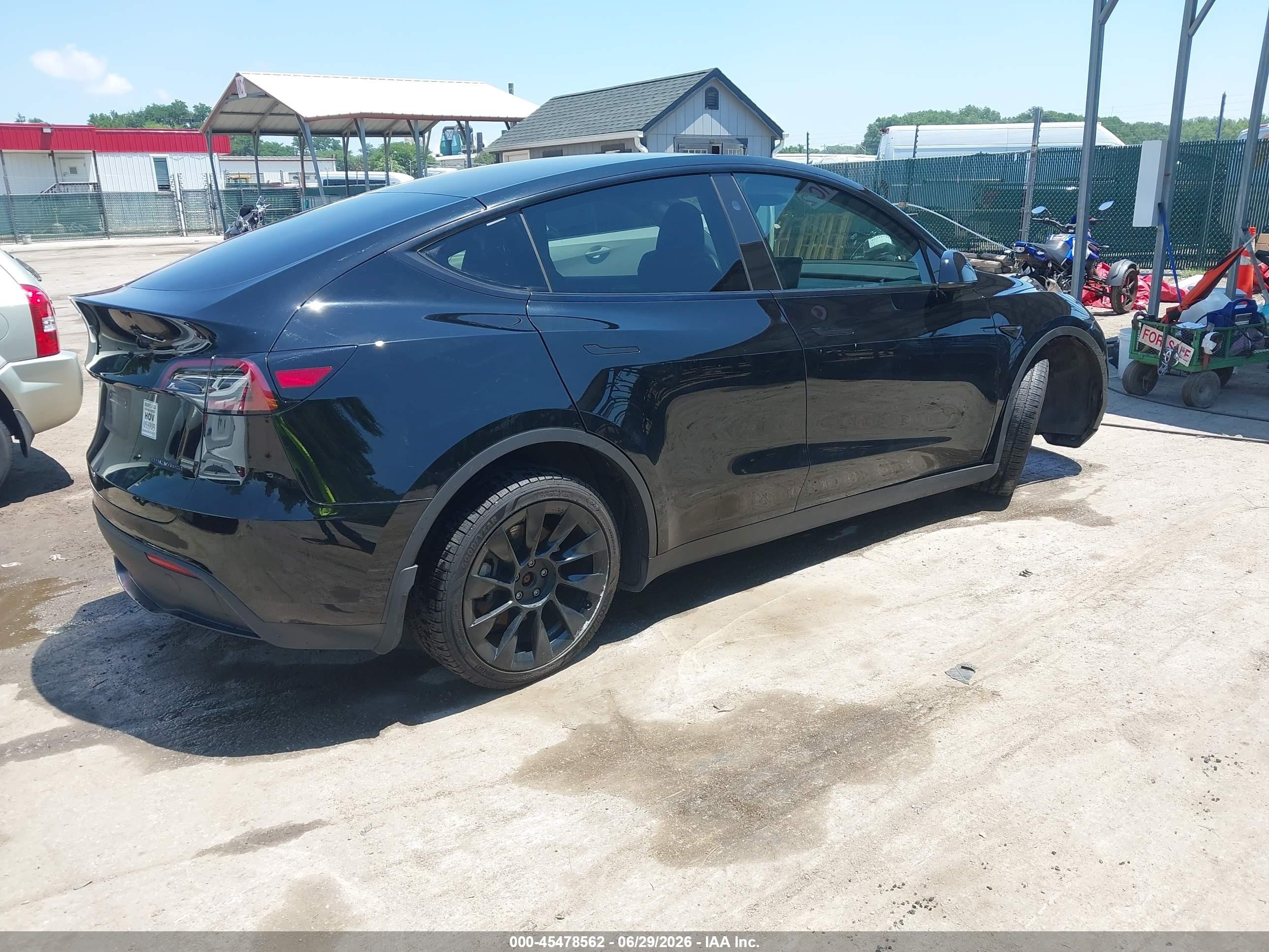 2024 Tesla Model y VIN 7SAYGDEE0RA214902 IAAI salvage auction — Unknown, Salvage - Greater Than 75% (Maryland), sold $7,350 on 2026-09-03 (photo 4)