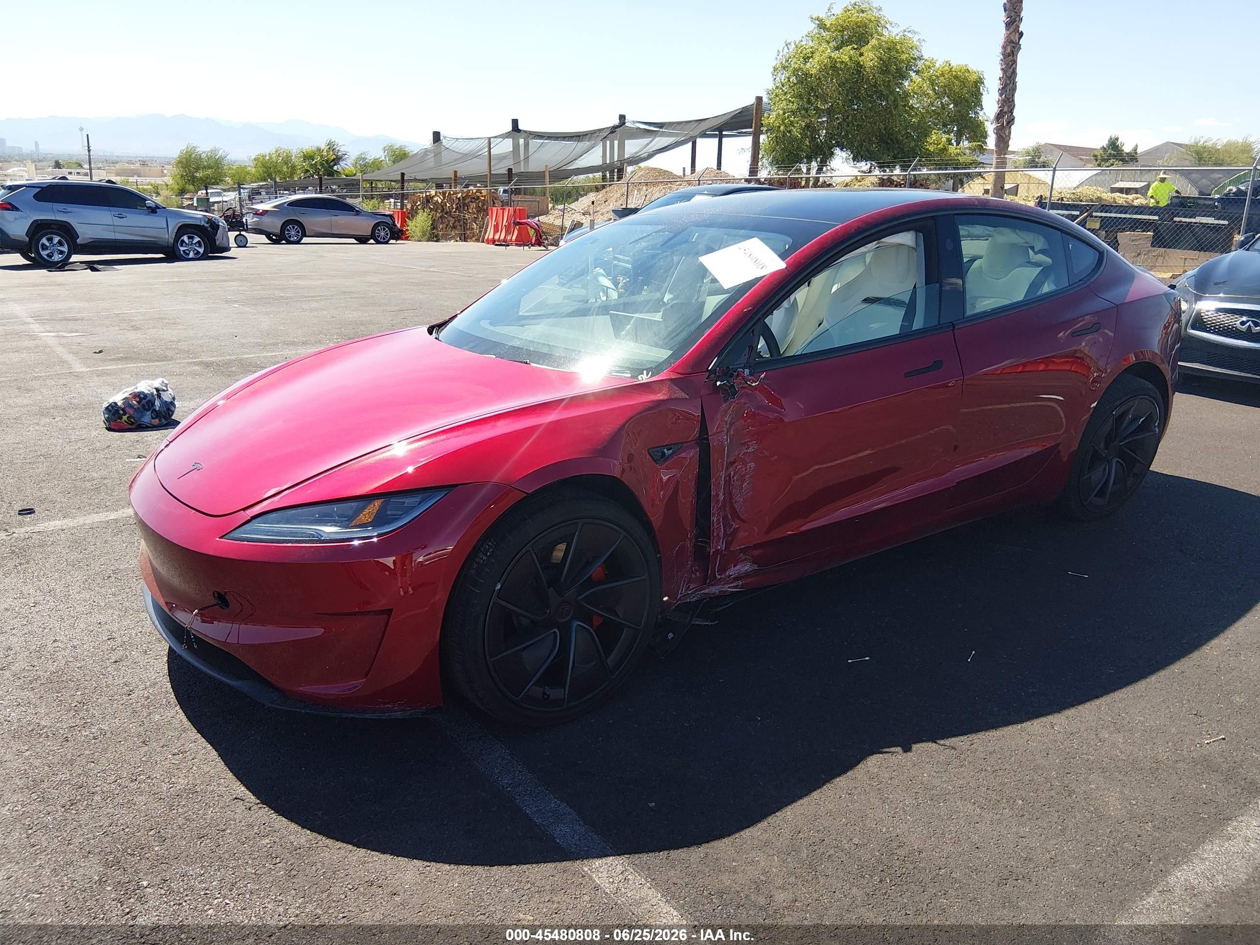 2026 Tesla Model 3 VIN 5YJ3E1ET7TF173396 IAAI salvage auction — Side, Salvage (Nevada), sold $15,700 on 2026-09-02 (photo 2)