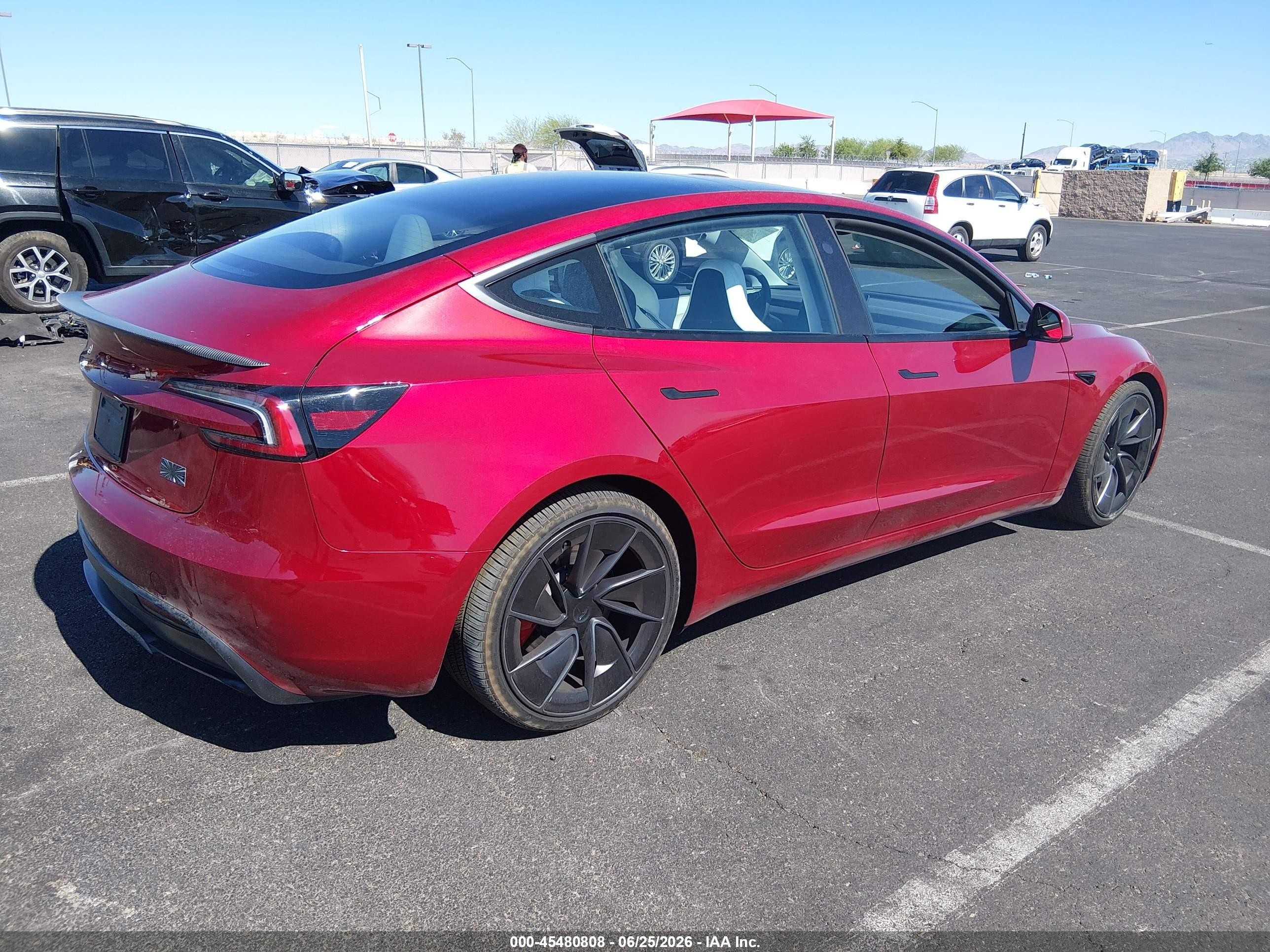 2026 Tesla Model 3 VIN 5YJ3E1ET7TF173396 IAAI salvage auction — Side, Salvage (Nevada), sold $15,700 on 2026-09-02 (photo 4)