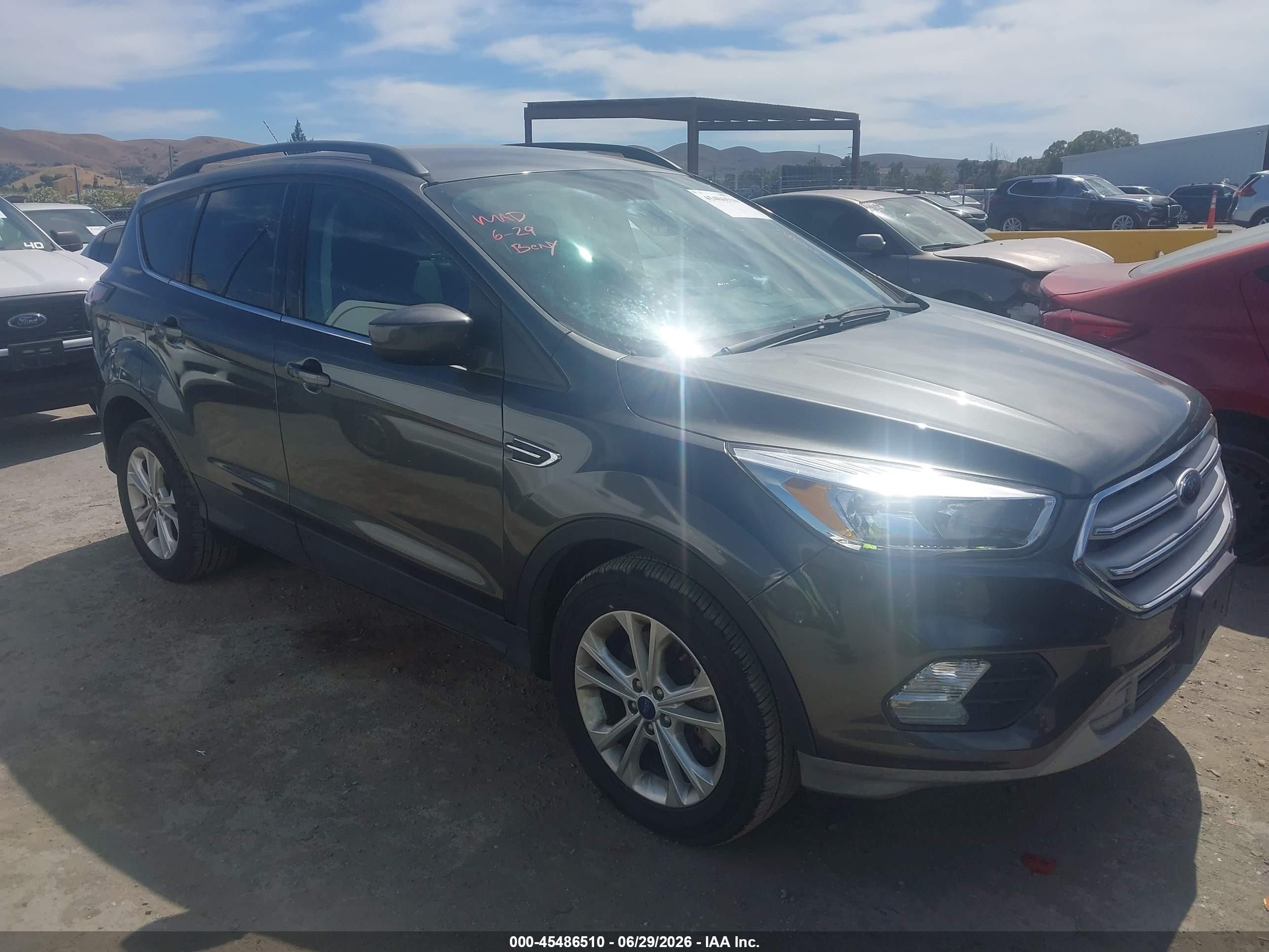 2018 Ford Escape VIN 1FMCU9GD5JUA10768 IAAI salvage auction — Normal Wear, Clear - Dealer Only (California), sold $1,000 on 2026-07-09 (photo 1)