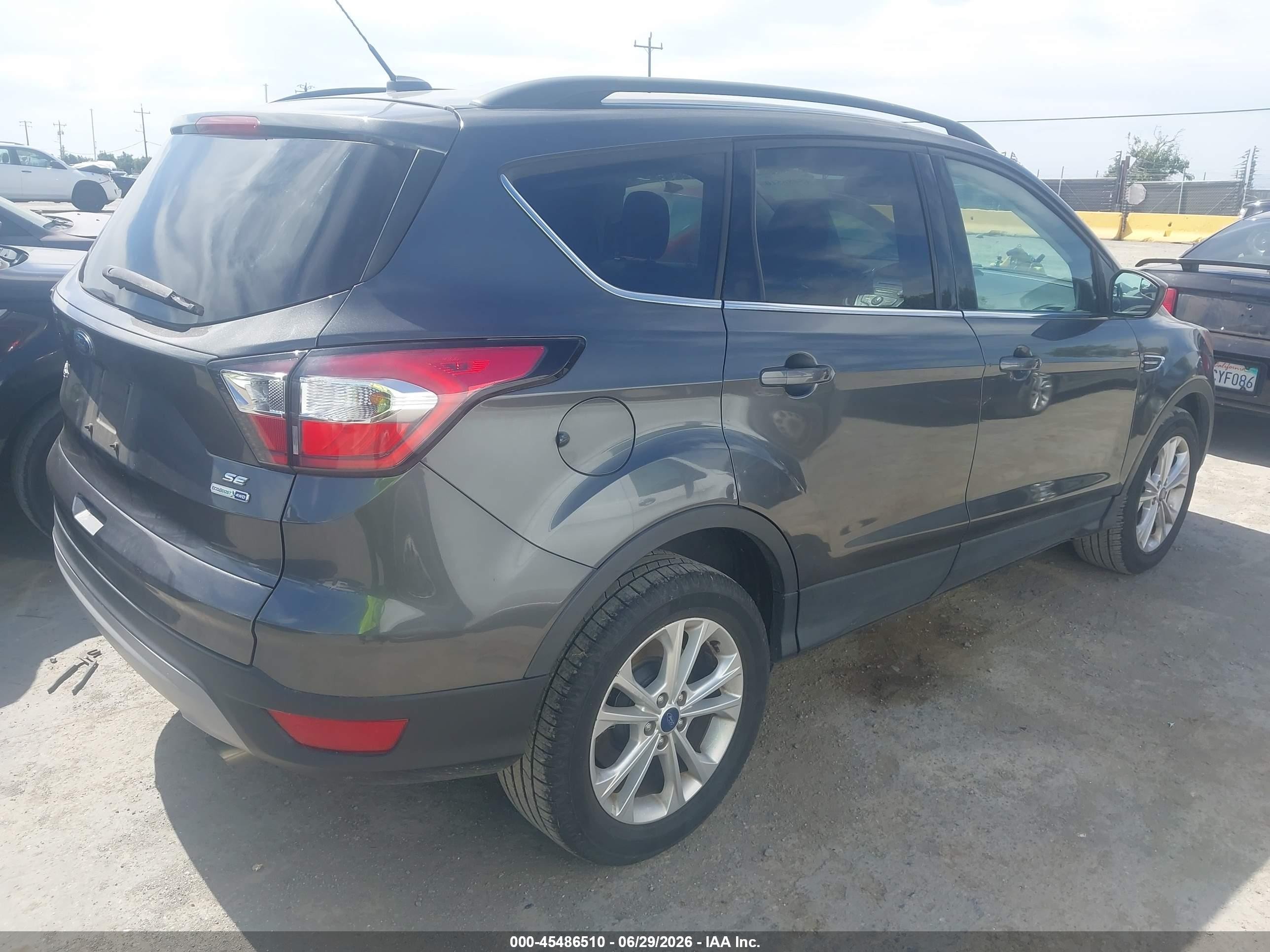 2018 Ford Escape VIN 1FMCU9GD5JUA10768 IAAI salvage auction — Normal Wear, Clear - Dealer Only (California), sold $1,000 on 2026-07-09 (photo 4)