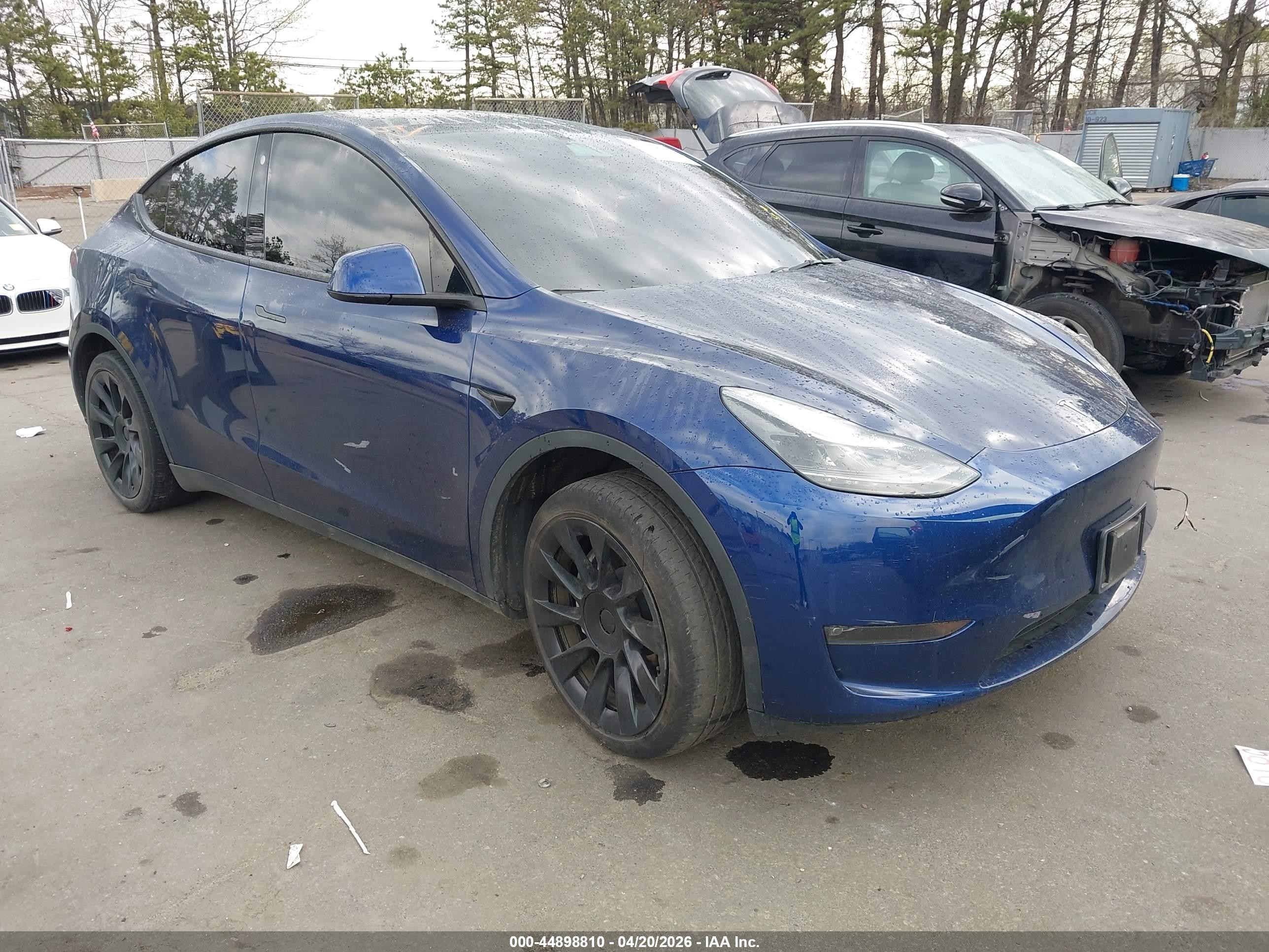 2023 Tesla Model Y VIN 7SAYGDEE9PF766981 IAAI salvage auction — Side, Mv-907A (New York), sold $12,825 on 2026-06-30 (photo 1)