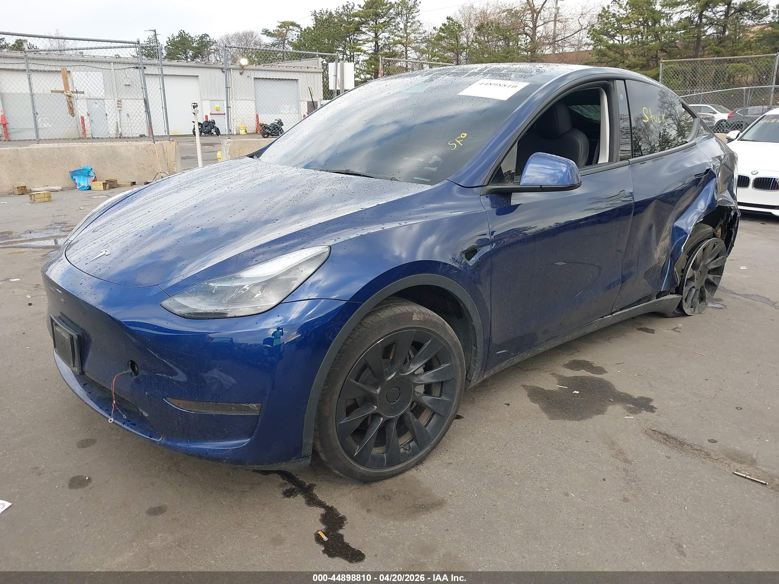 2023 Tesla Model Y VIN 7SAYGDEE9PF766981 IAAI salvage auction — Side, Mv-907A (New York), sold $12,825 on 2026-06-30 (photo 2)