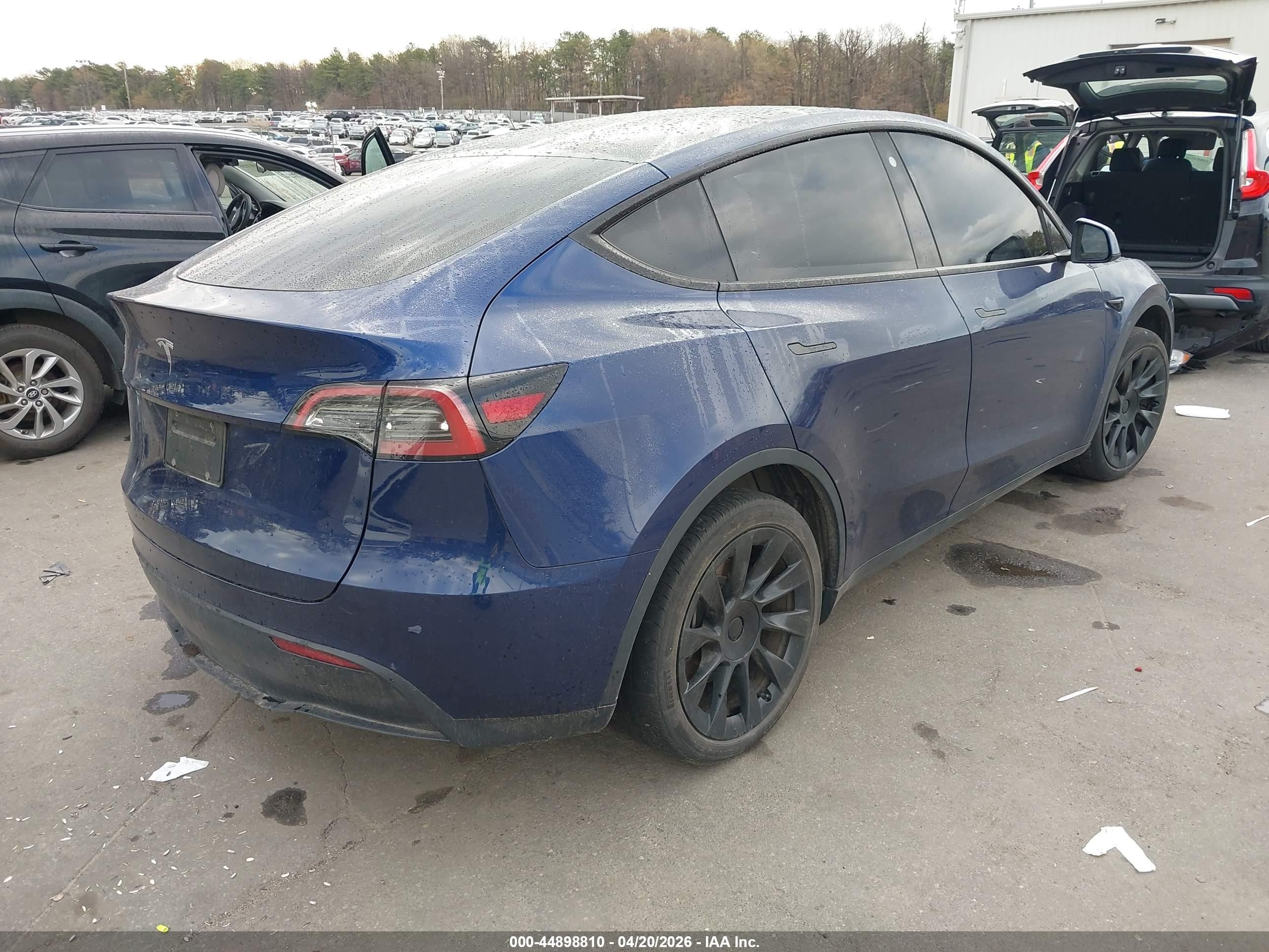 2023 Tesla Model Y VIN 7SAYGDEE9PF766981 IAAI salvage auction — Side, Mv-907A (New York), sold $12,825 on 2026-06-30 (photo 4)