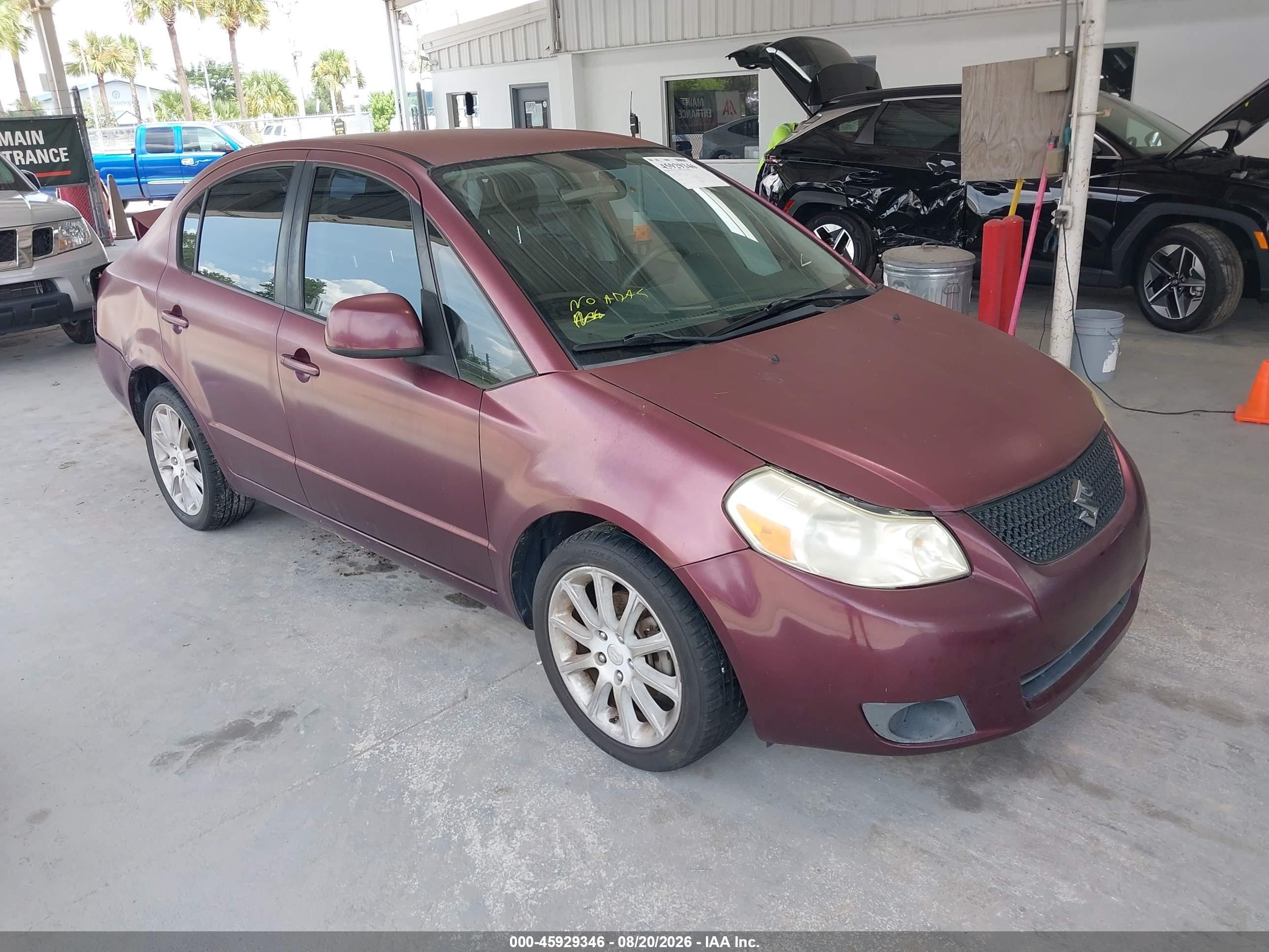 2011 Suzuki Sx4 VIN JS2YC5A27B6303273 IAAI salvage auction — Rear End, Rebuildable (Florida), sold $500 on 2026-09-09 (photo 1)