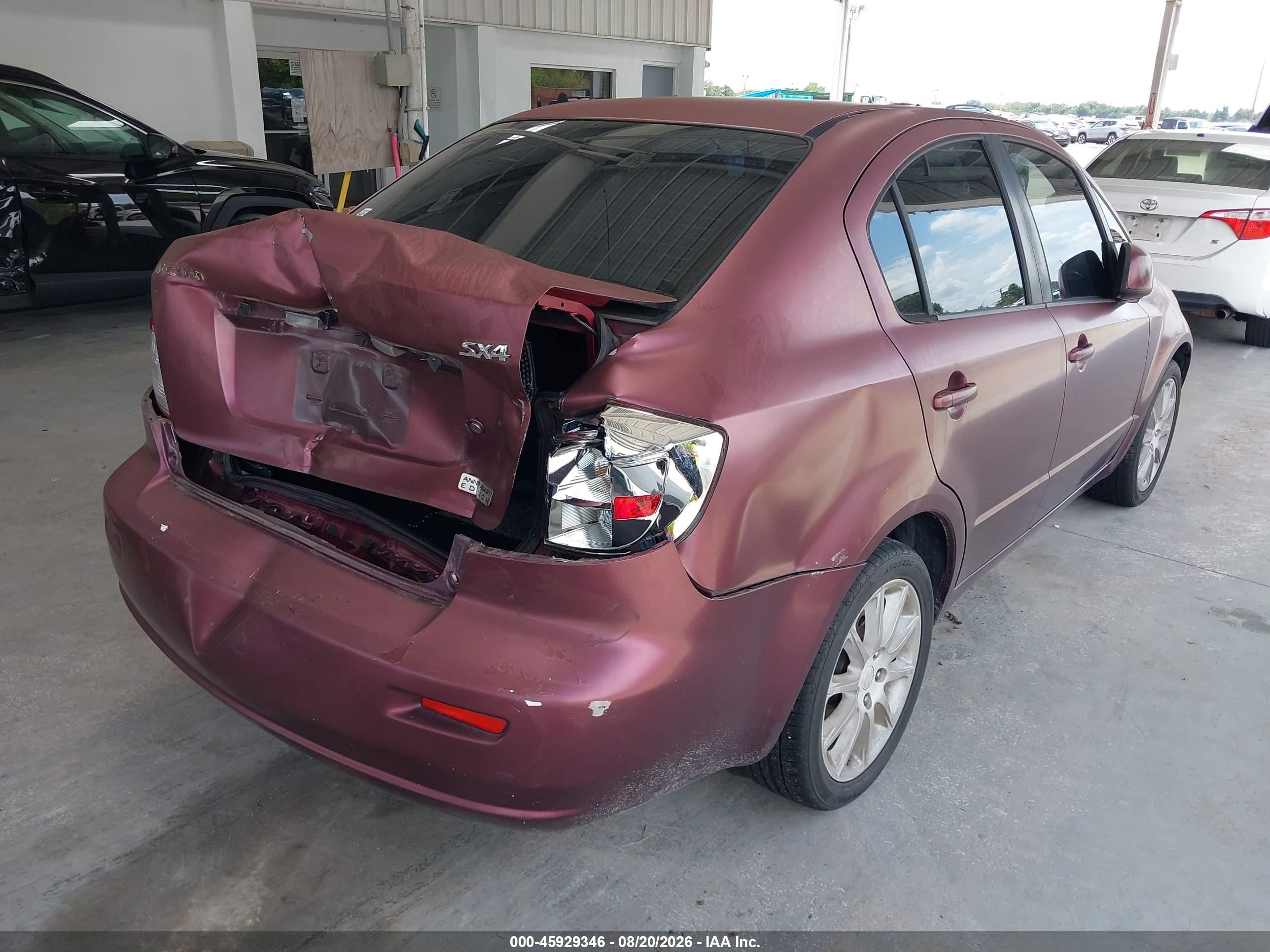 2011 Suzuki Sx4 VIN JS2YC5A27B6303273 IAAI salvage auction — Rear End, Rebuildable (Florida), sold $500 on 2026-09-09 (photo 4)