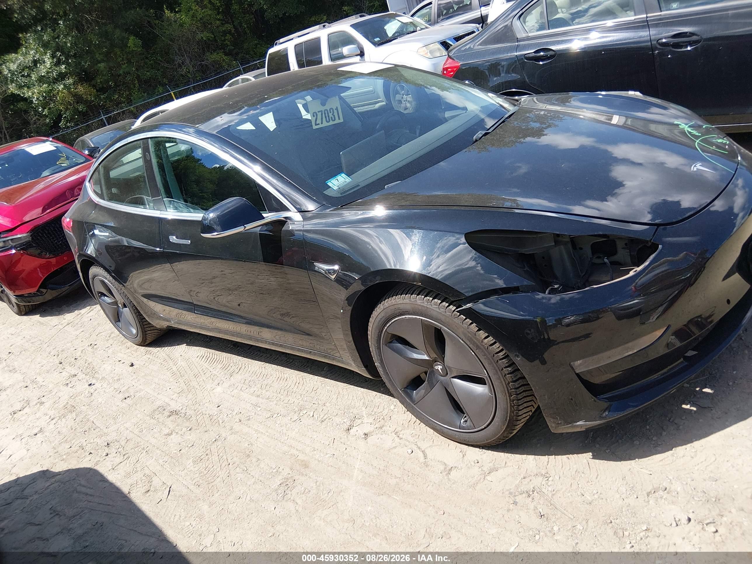 2018 Tesla Model 3 VIN 5YJ3E1EB7JF119021 — IAAI salvage auction photo
