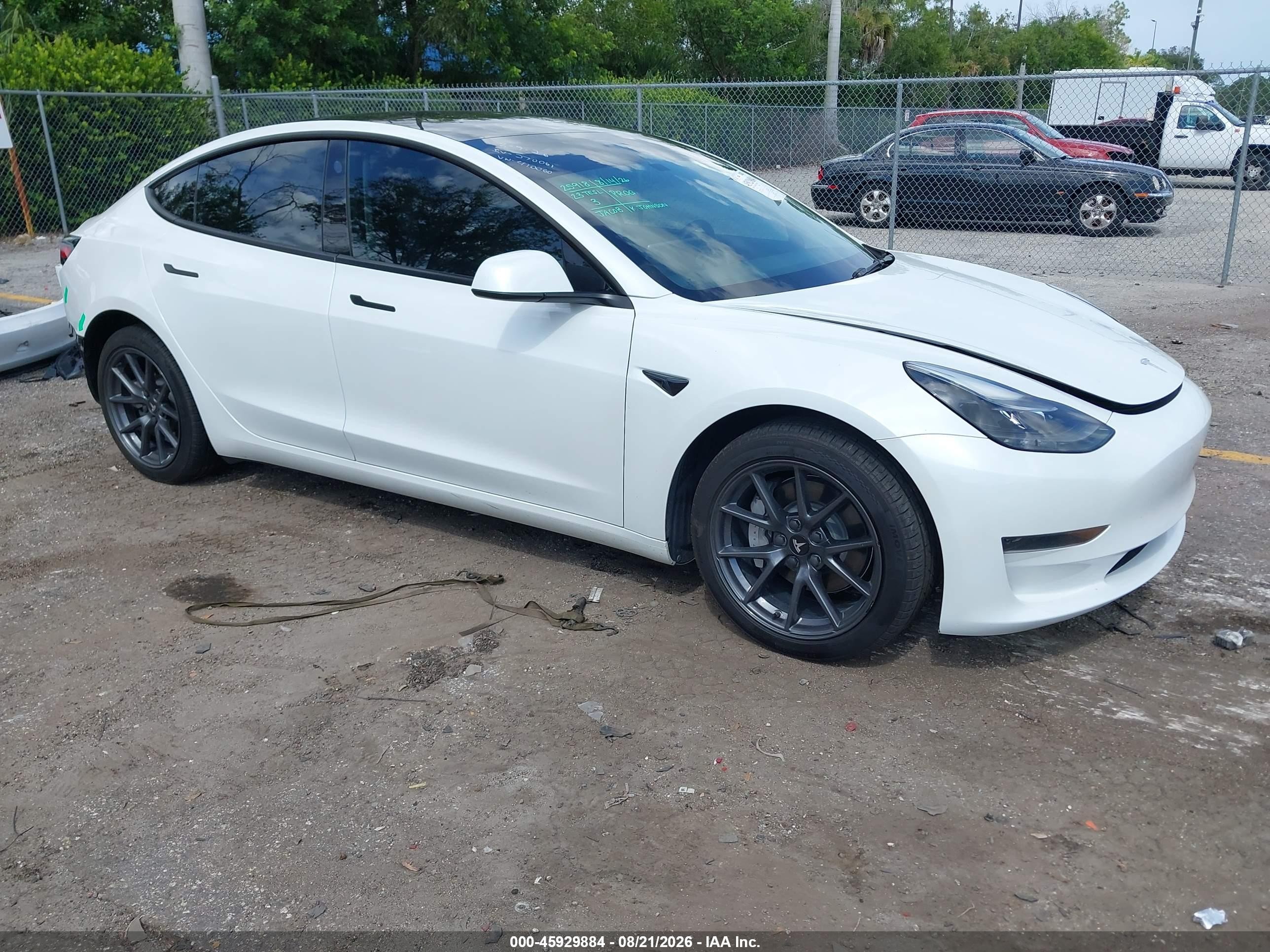 2023 Tesla Model 3 VIN 5YJ3E1EA3PF401060 — IAAI salvage auction photo