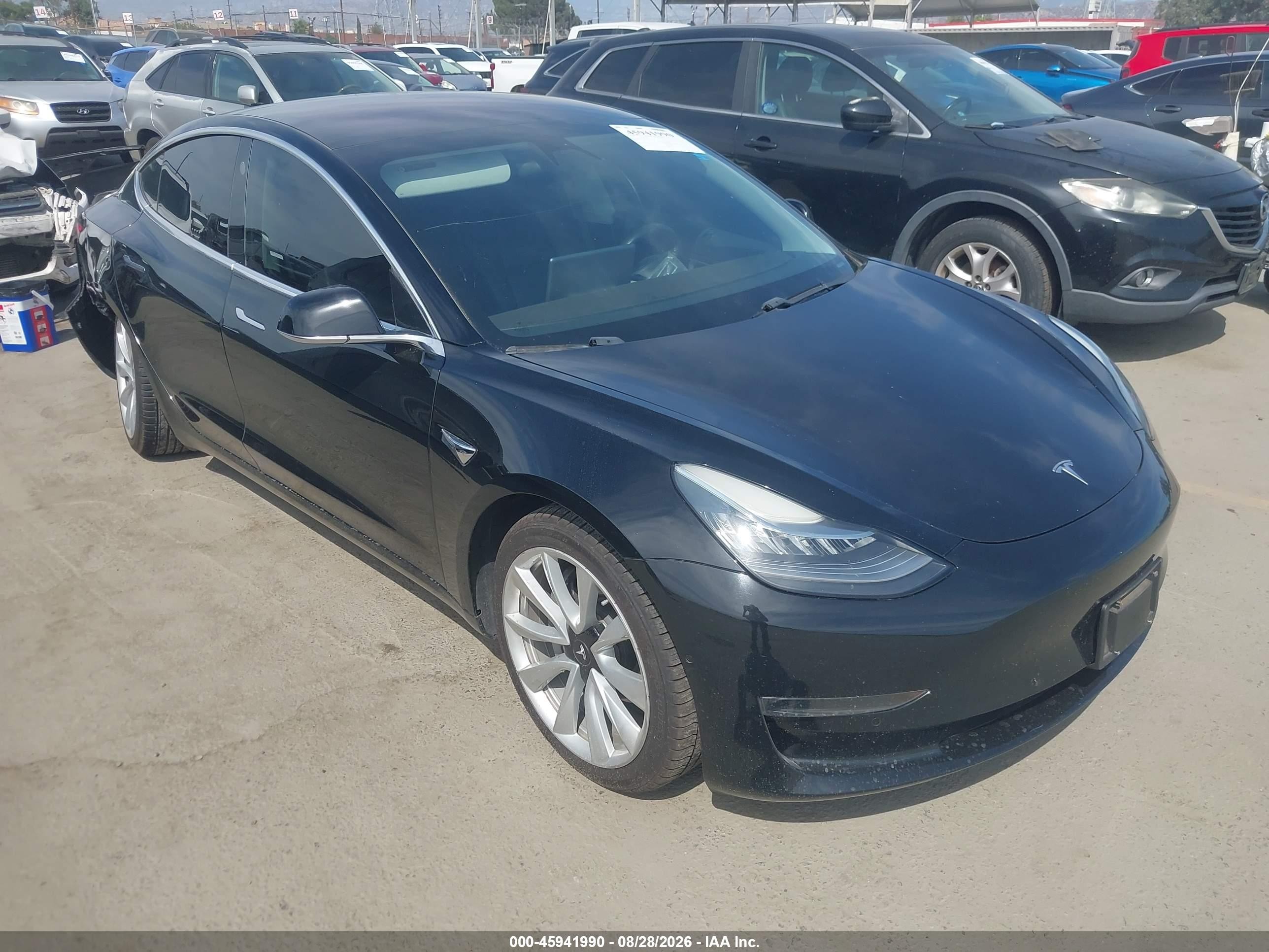 2018 Tesla Model 3 VIN 5YJ3E1EA1JF075850 — IAAI salvage auction photo