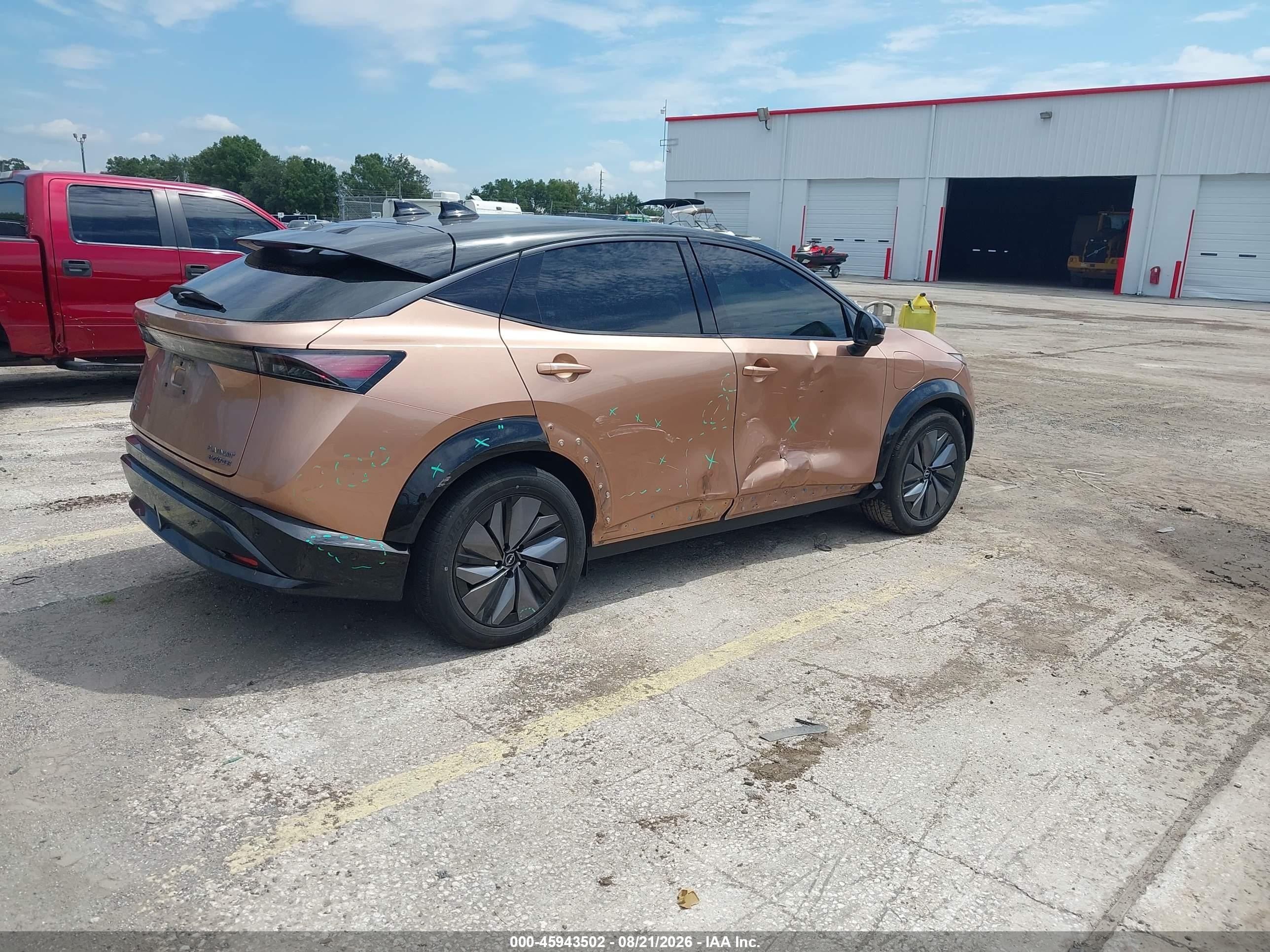 2024 Nissan Ariya VIN JN1DF0CD5RM730168 IAAI salvage auction — Side, Rebuildable (Florida), sold $15,600 on 2026-10-05 (photo 4)