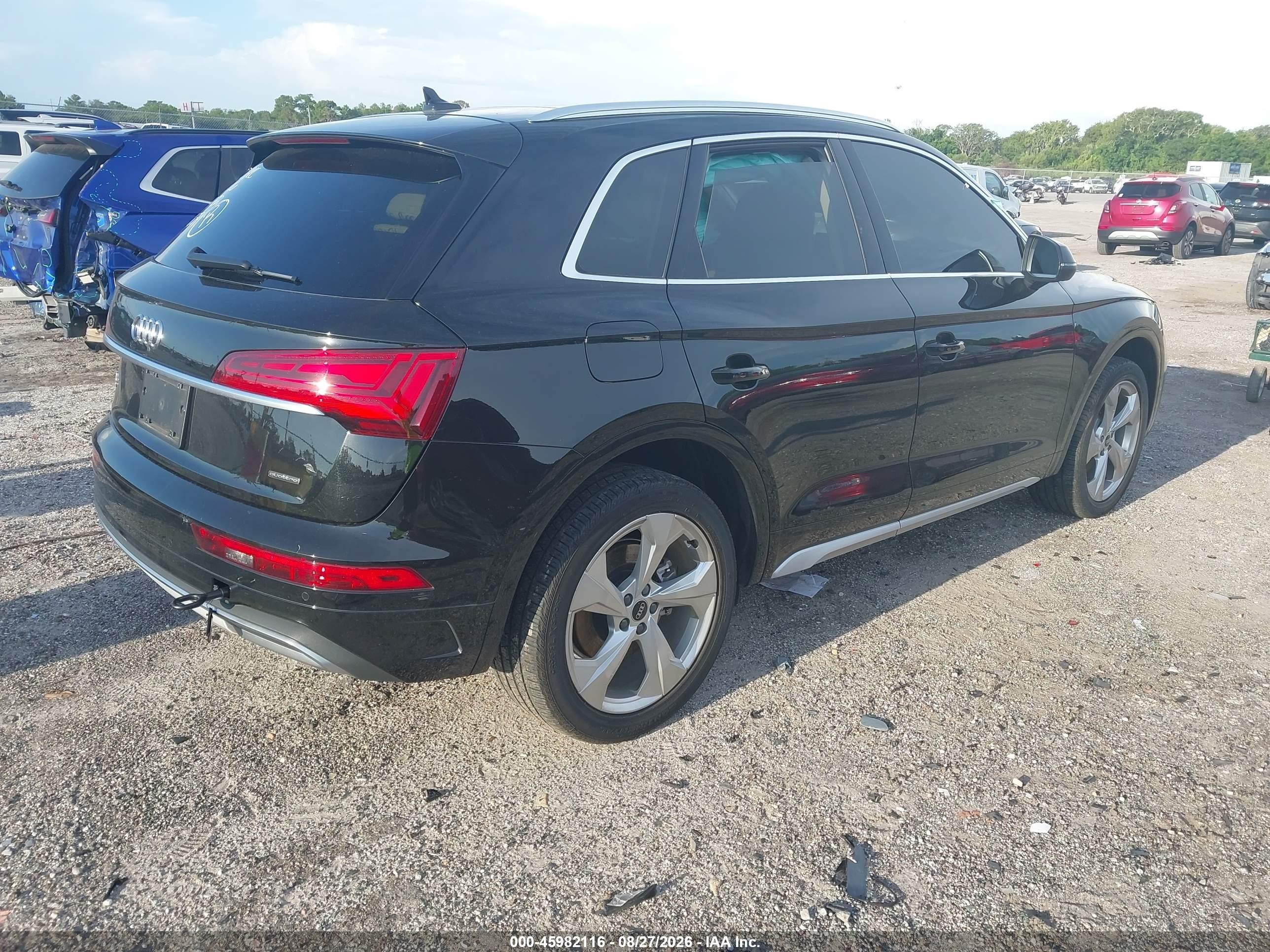 2021 Audi Q5 VIN WA1BAAFYXM2102659 IAAI salvage auction — Side, Rebuildable (Florida), sold $9,700 on 2026-10-12 (photo 4)