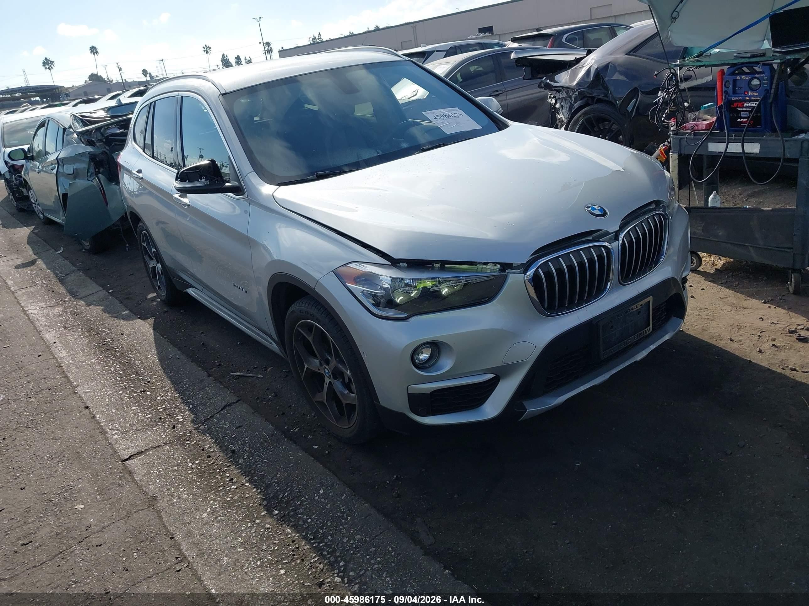 2016 BMW X1 VIN WBXHT3C33G5F65699 IAAI salvage auction — Side, Salvage Certificate (California), sold $4,950 on 2026-09-12 (photo 1)