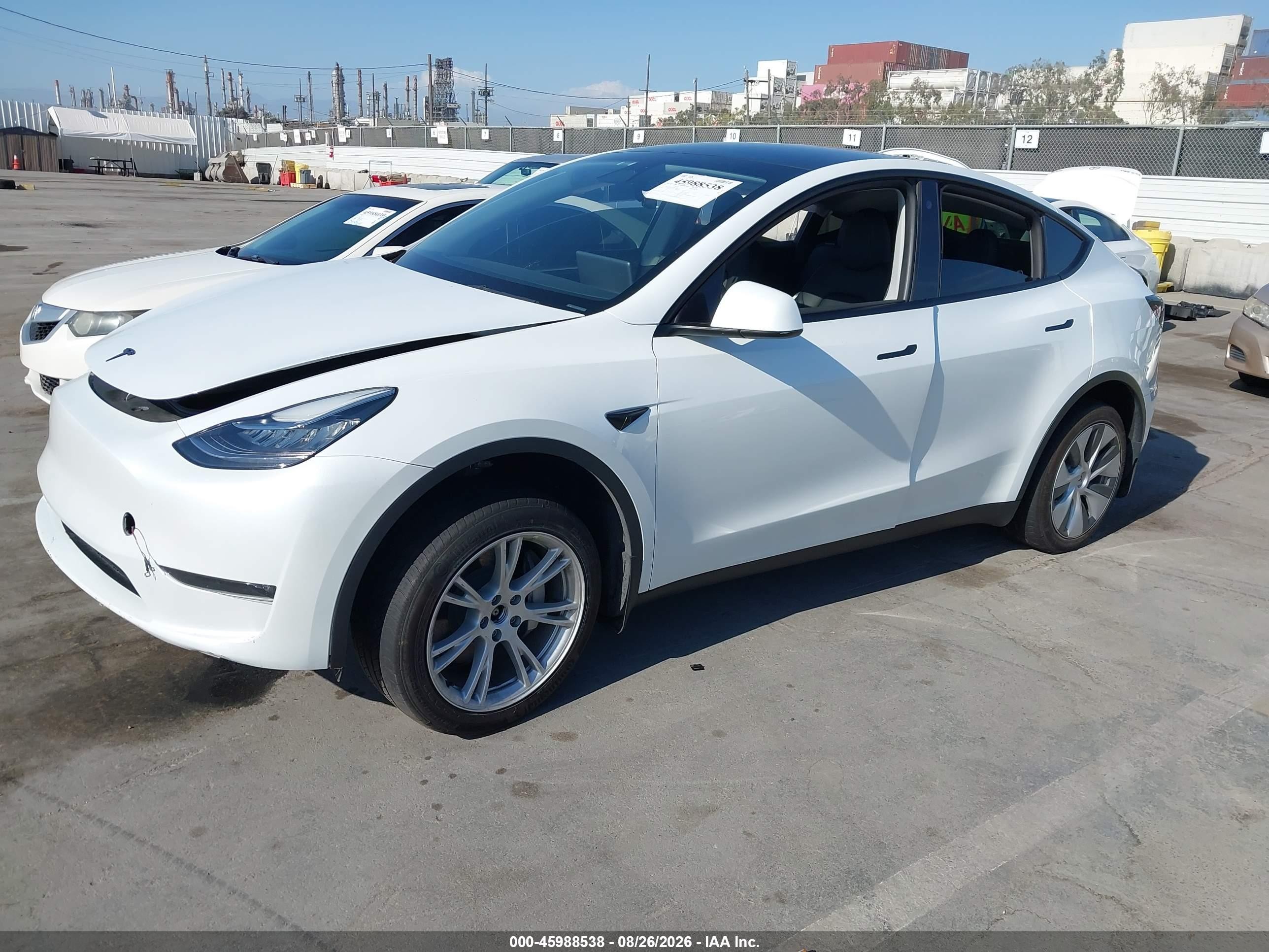 2023 Tesla Model Y VIN 7SAYGDEE2PA063588 IAAI salvage auction — Side, Salvage (California), sold $7,500 on 2026-09-11 (photo 2)