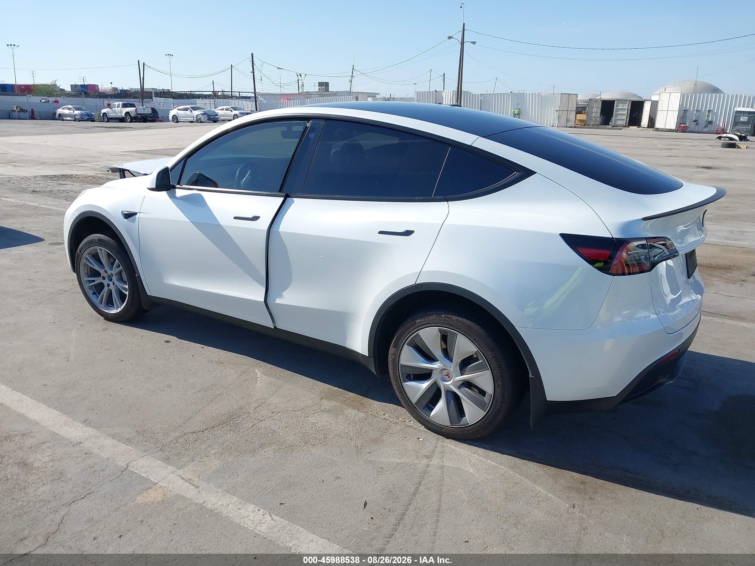 2023 Tesla Model Y VIN 7SAYGDEE2PA063588 IAAI salvage auction — Side, Salvage (California), sold $7,500 on 2026-09-11 (photo 3)