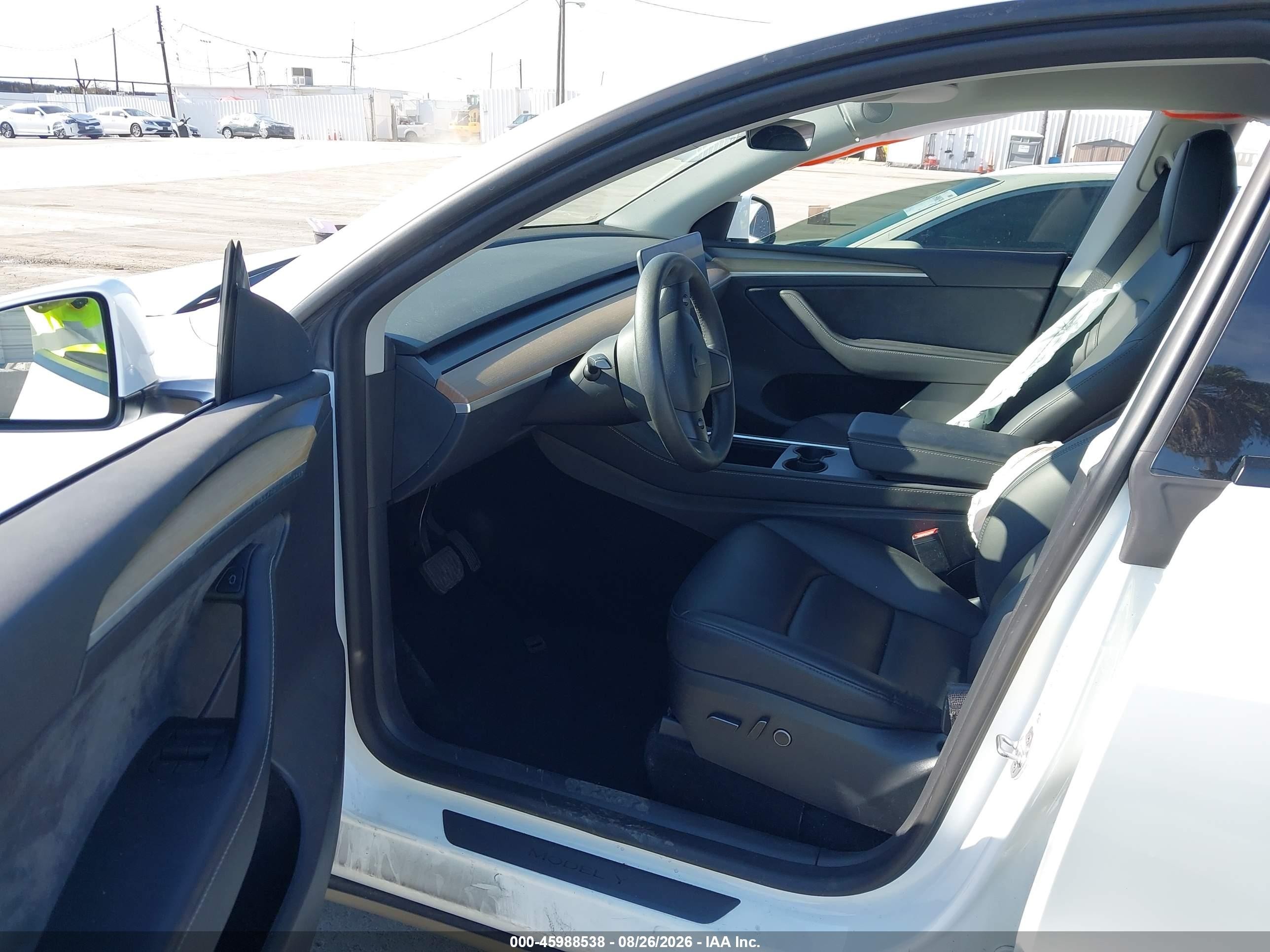 2023 Tesla Model Y VIN 7SAYGDEE2PA063588 IAAI salvage auction — Side, Salvage (California), sold $7,500 on 2026-09-11 (photo 5)