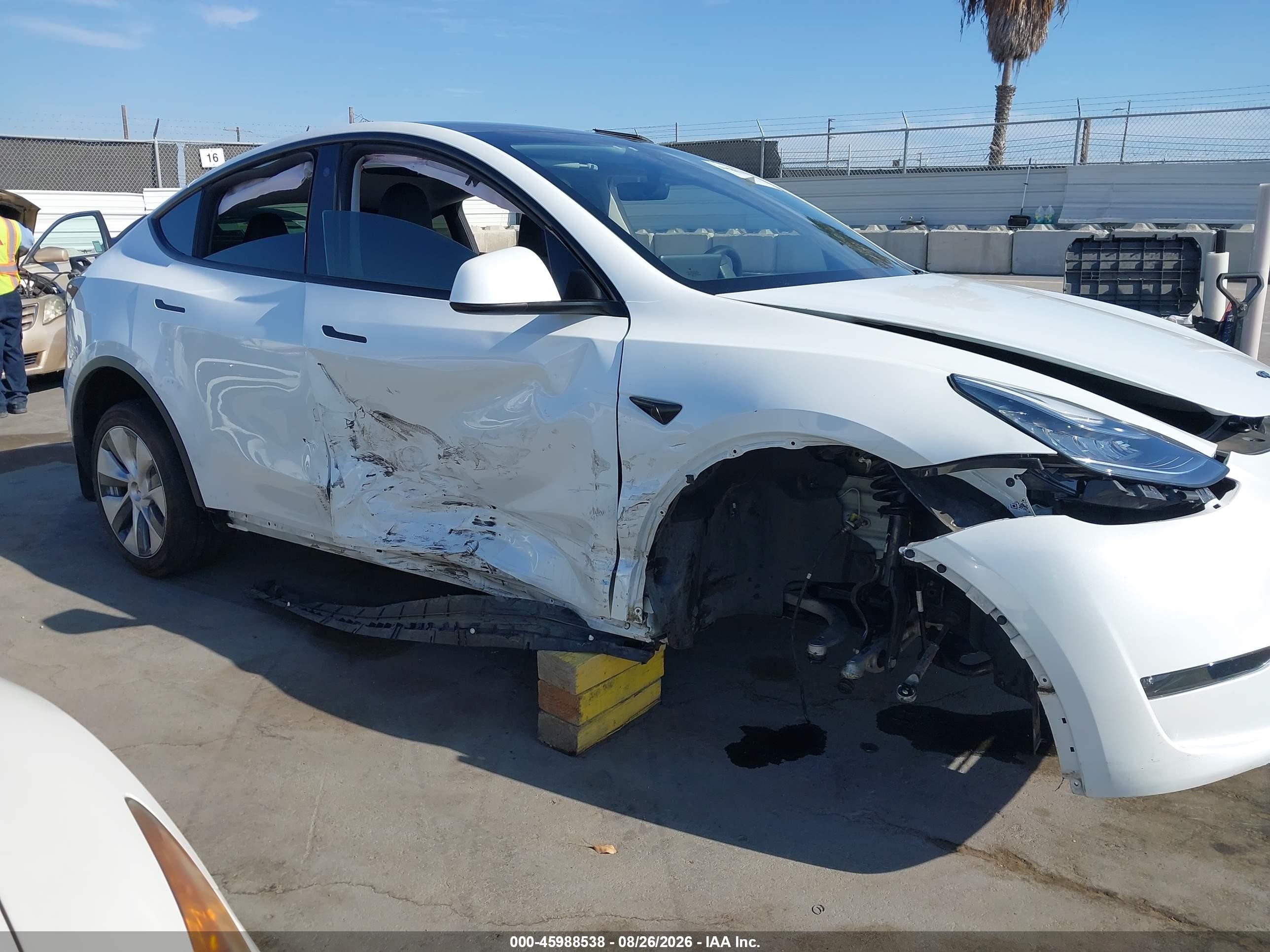 2023 Tesla Model Y VIN 7SAYGDEE2PA063588 IAAI salvage auction — Side, Salvage (California), sold $7,500 on 2026-09-11 (photo 6)