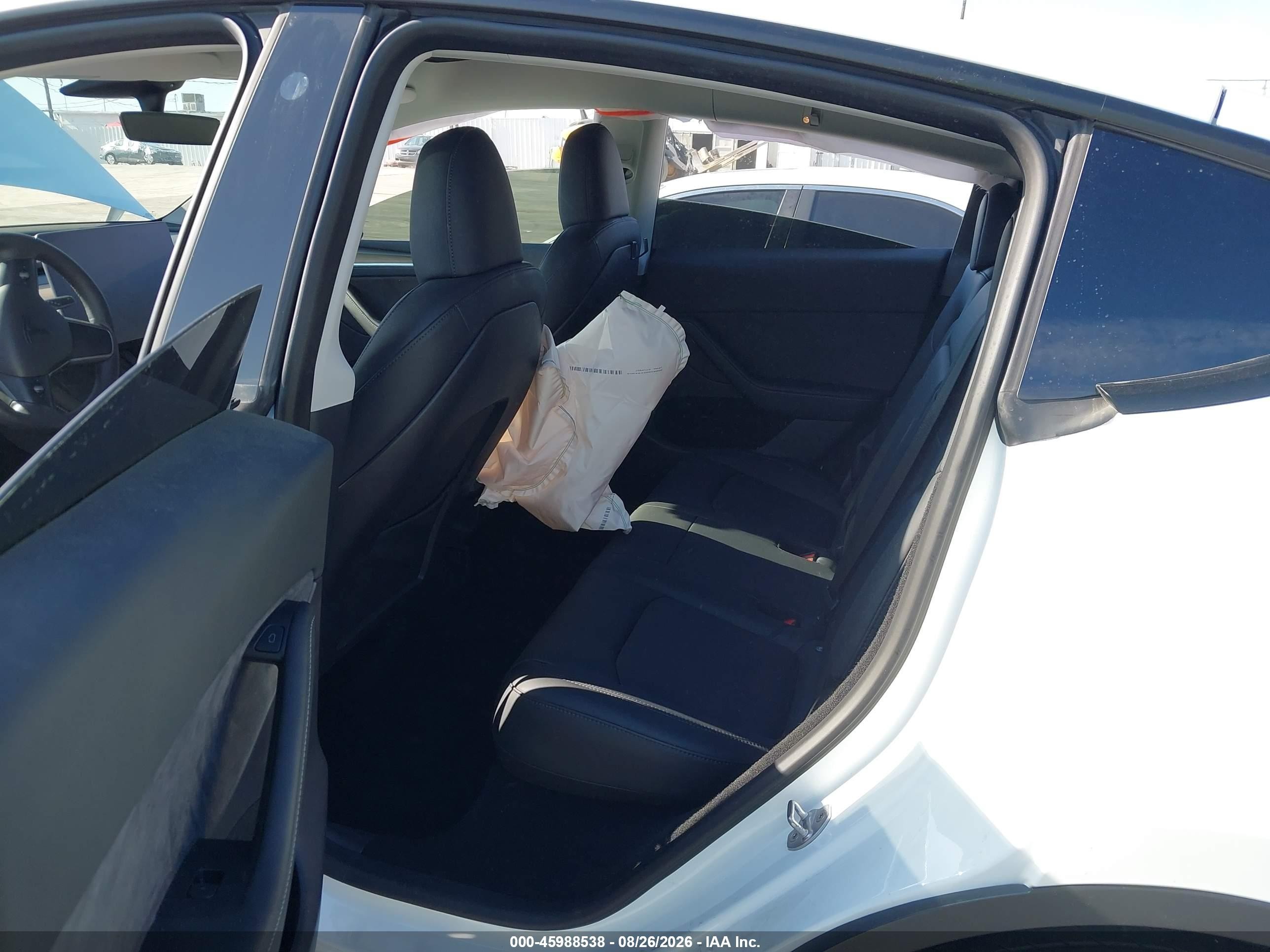 2023 Tesla Model Y VIN 7SAYGDEE2PA063588 IAAI salvage auction — Side, Salvage (California), sold $7,500 on 2026-09-11 (photo 8)